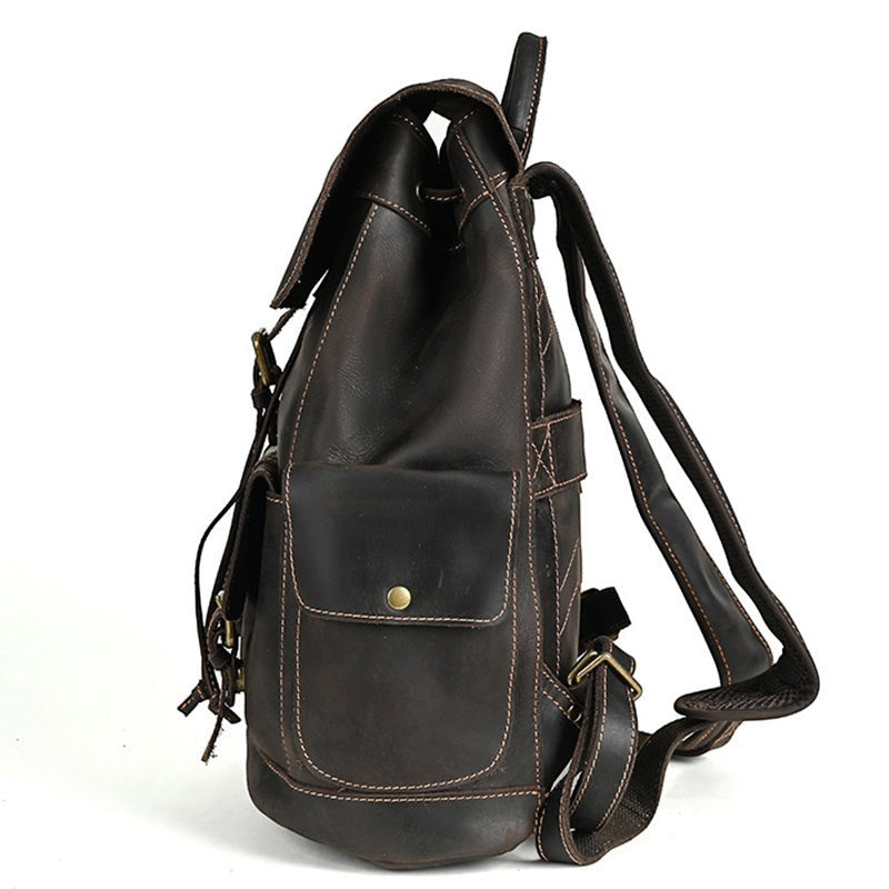 Barcon Getta Inc dark brown genuine leather backpack with exterior pockets and brass hardware.