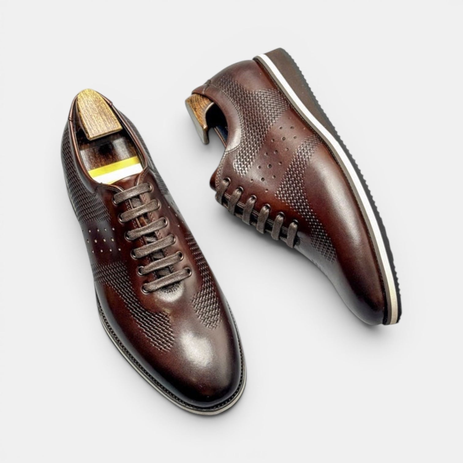Barcon Getta Inc DESSIE CROSSOVER dark brown full grain leather dress shoes with sneaker sole and perforated details.