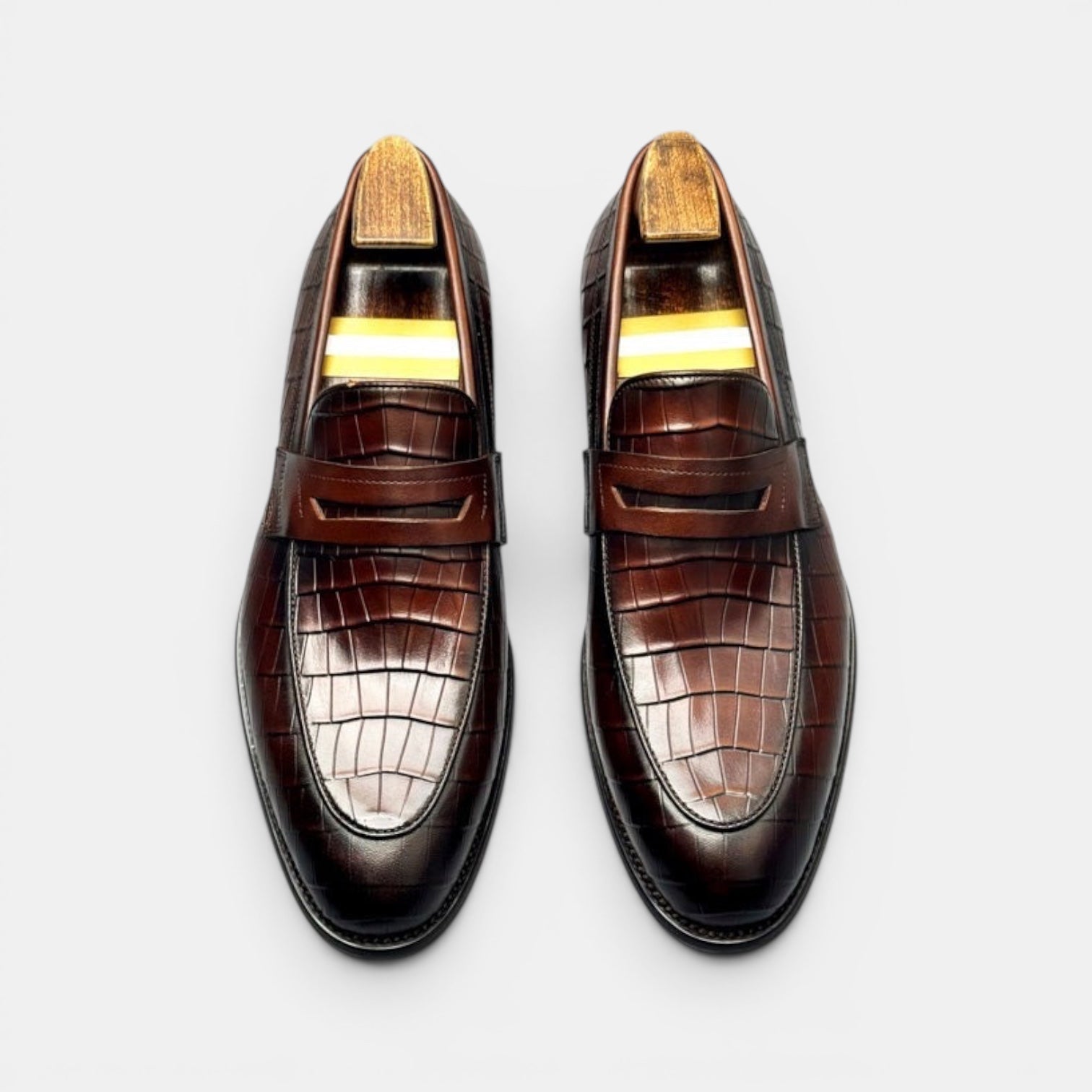 Barcon Getta Inc BRAZZAVILLE men's dark brown crocodile-embossed leather penny loafers with a sleek silhouette.