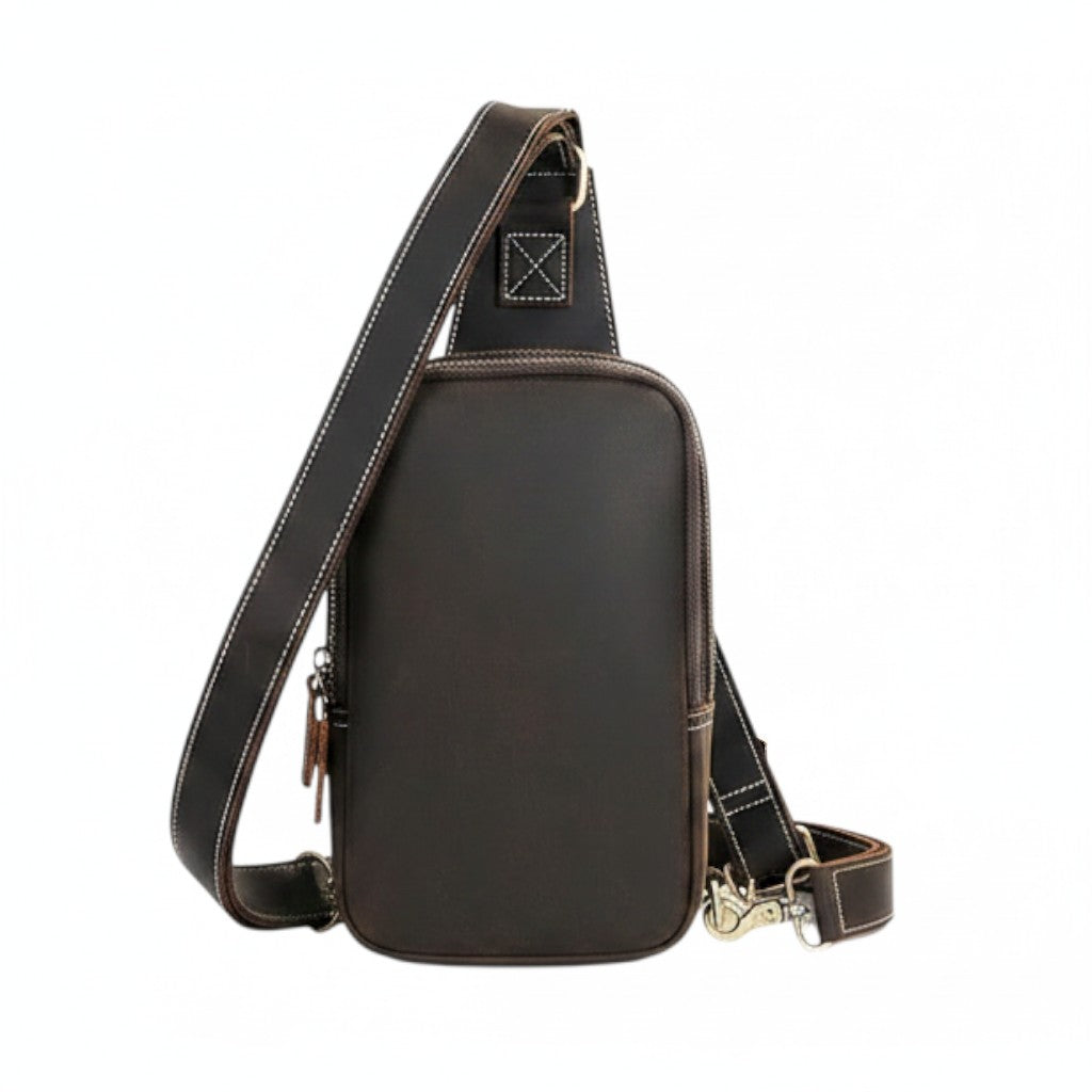 Barcon Getta Inc dark brown genuine leather cross-body bag with adjustable strap and multiple compartments, shown with an iPad for scale.