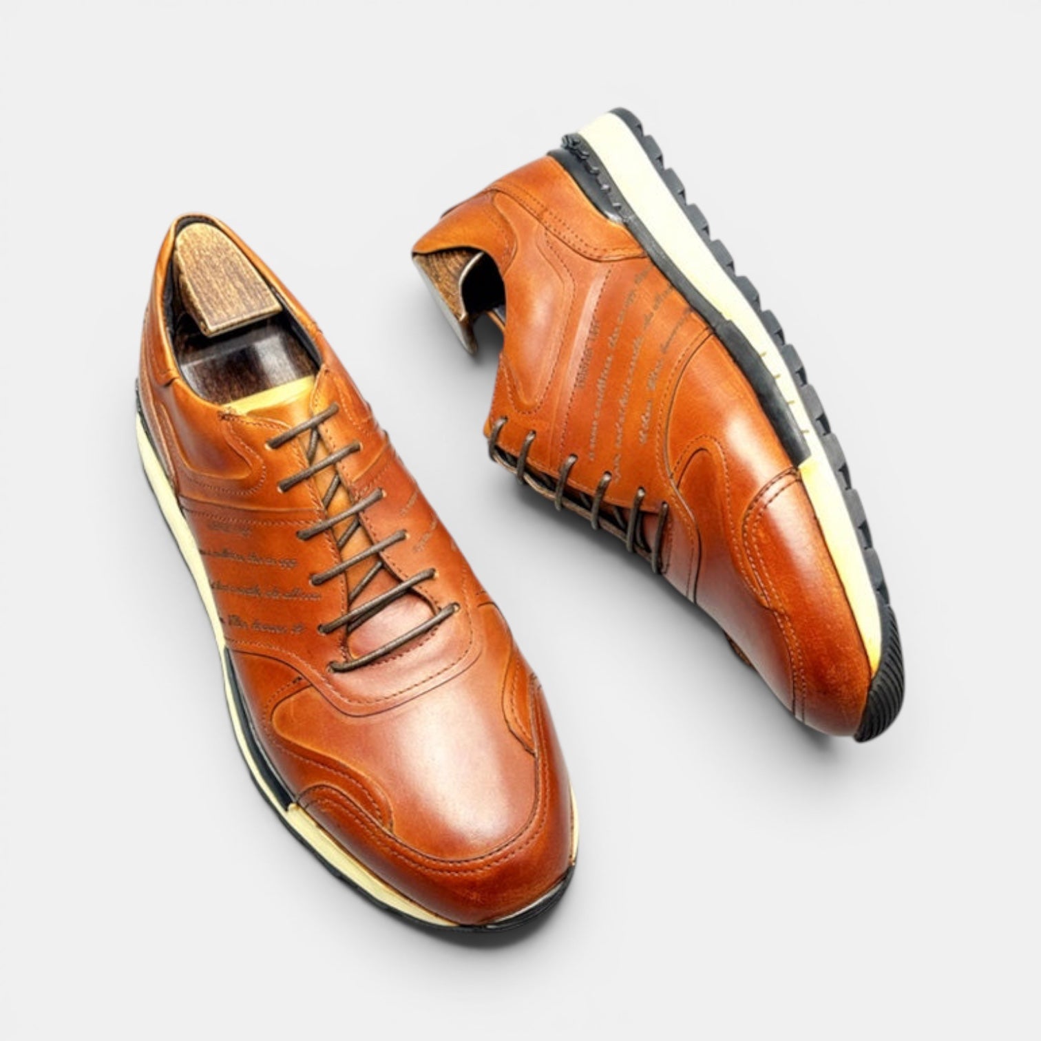 Barcon Getta Inc FREETOWN cognac tan full grain leather cap toe casual sneakers with a chunky lug sole.