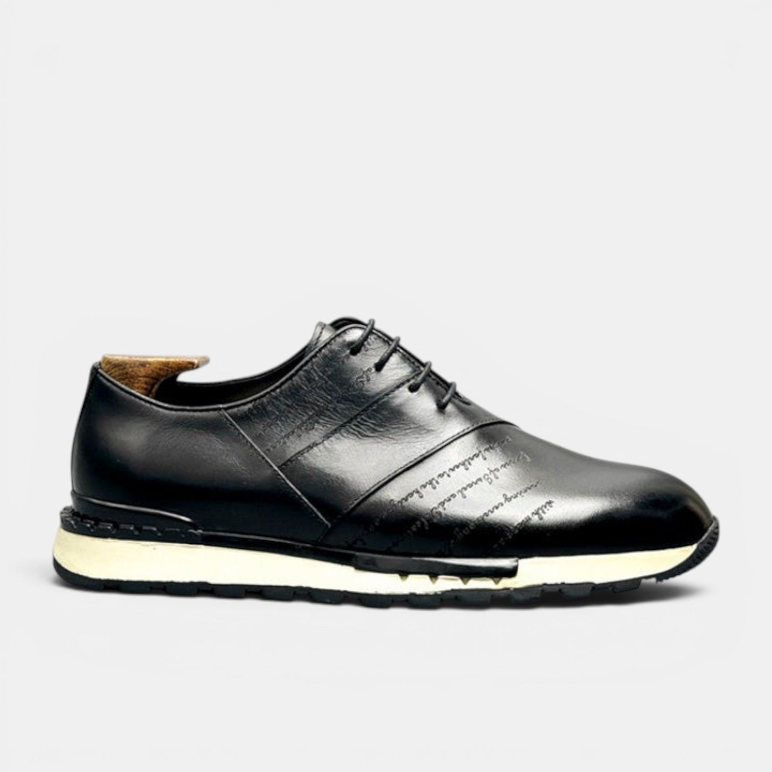 Barcon Getta Inc FREETOWN SHARP black leather sneakers with embossed script and chunky lug sole.