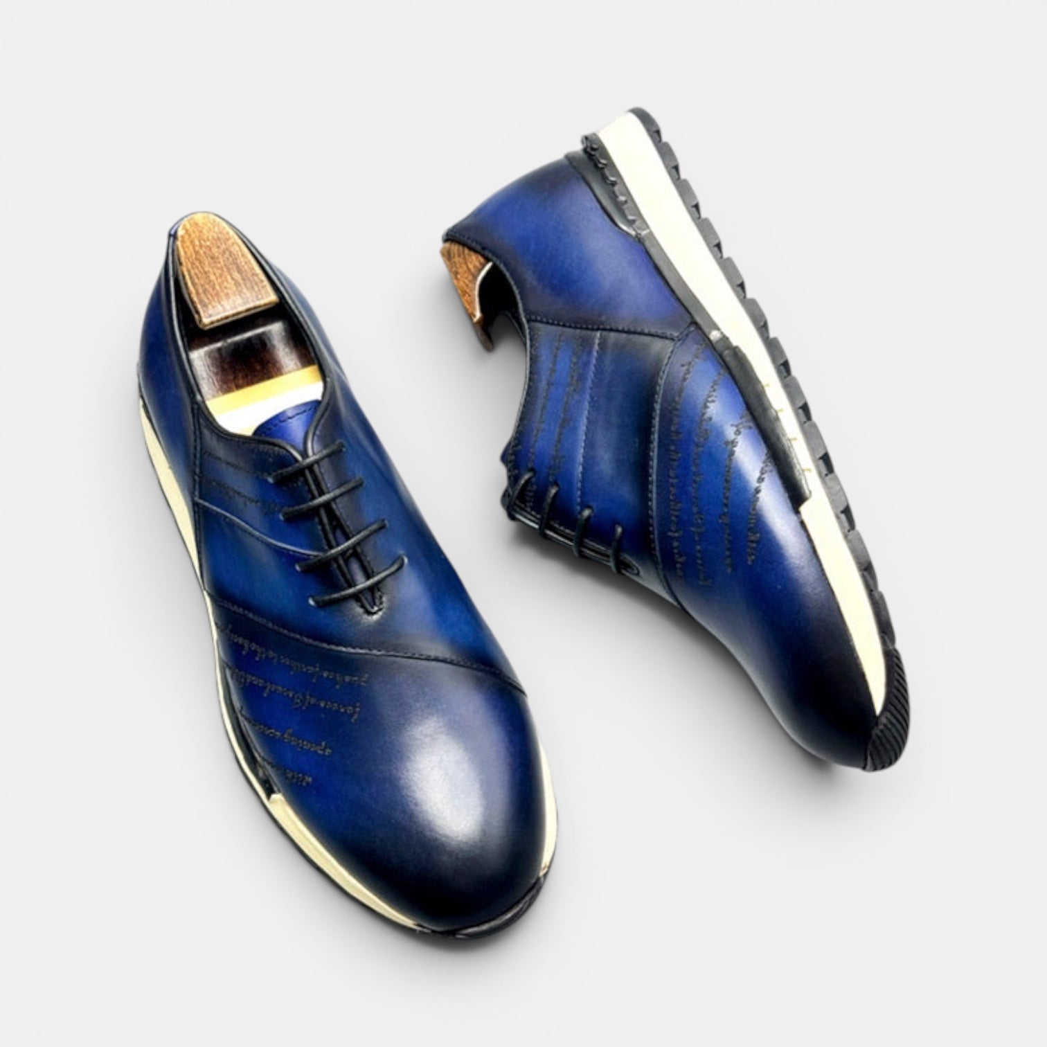 Barcon Getta Inc FREETOWN SHARP deep navy blue hand-burnished leather sneakers with embossed script and chunky lug sole.