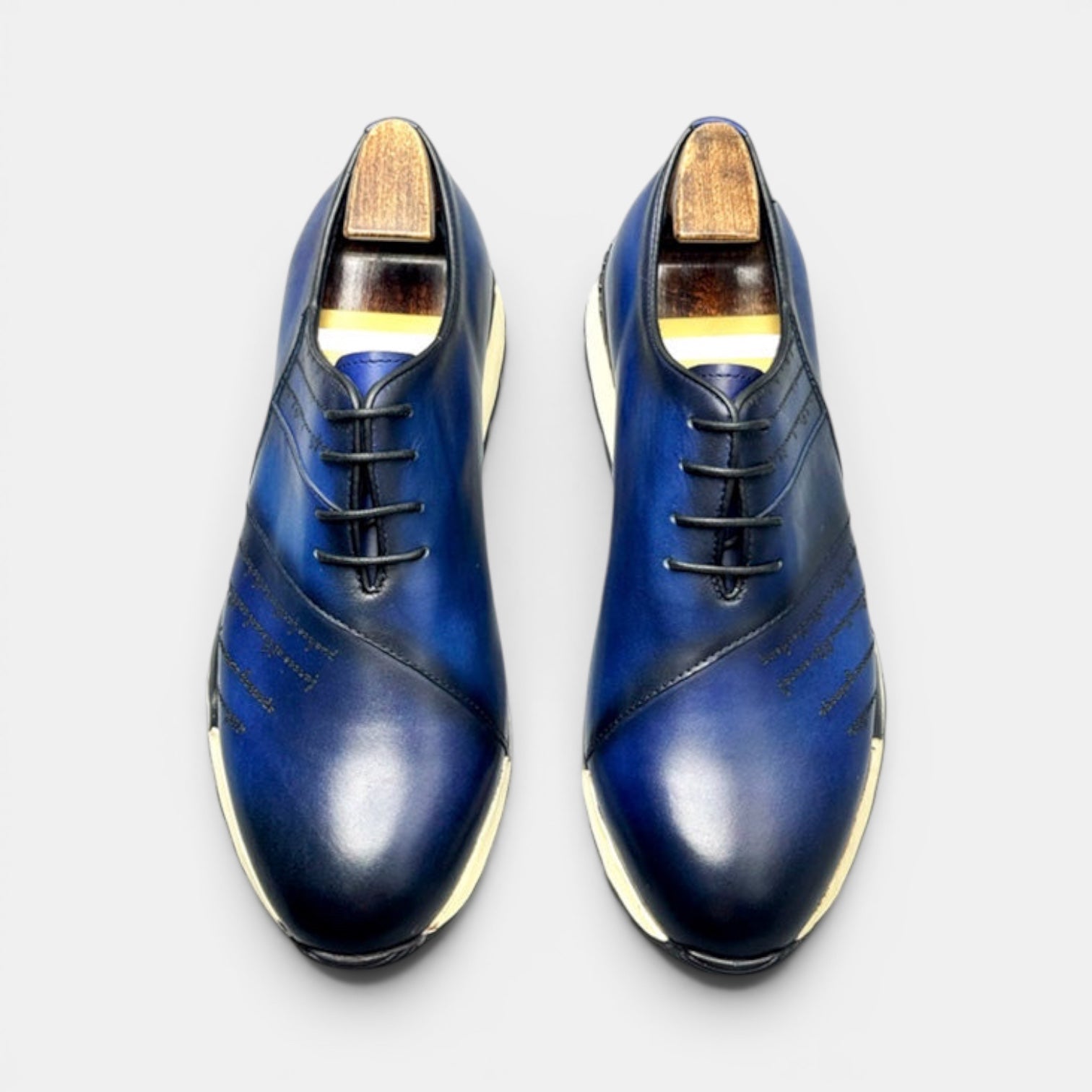 Barcon Getta Inc FREETOWN SHARP hand-burnished deep navy blue leather sneakers with white EVA midsole and black lug sole.