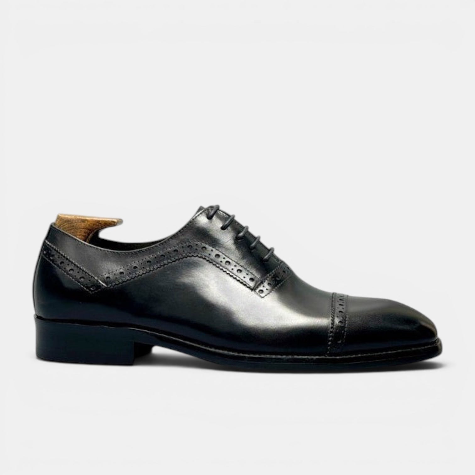 Barcon Getta Inc GITEGA black full grain leather cap toe Oxford dress shoes with brogue detailing and hybrid sole.