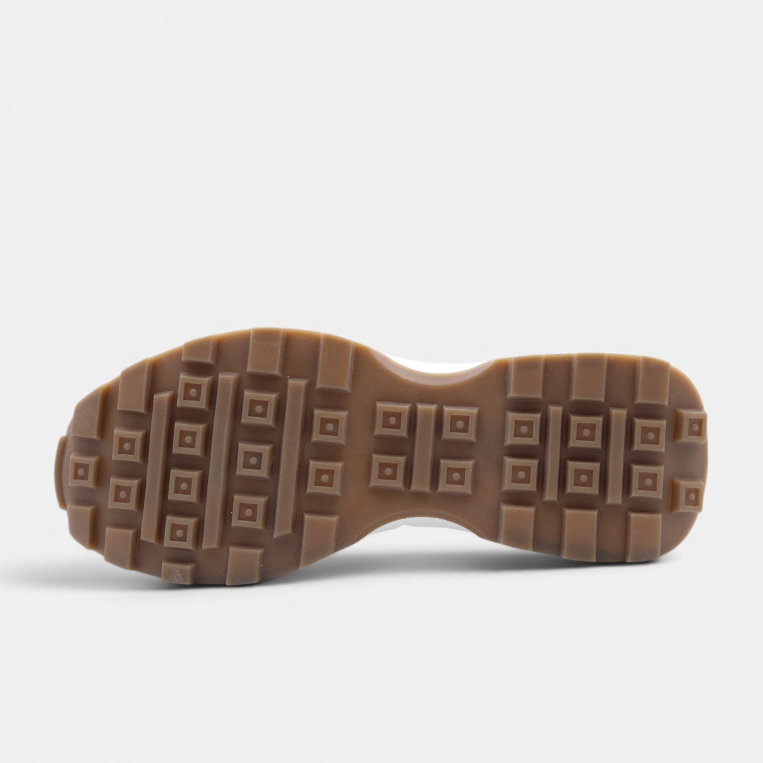 Barcon Getta Inc GUYA Sneaker with dark navy and white leather, tan heel, and gum caramel outsole with square grid tread.