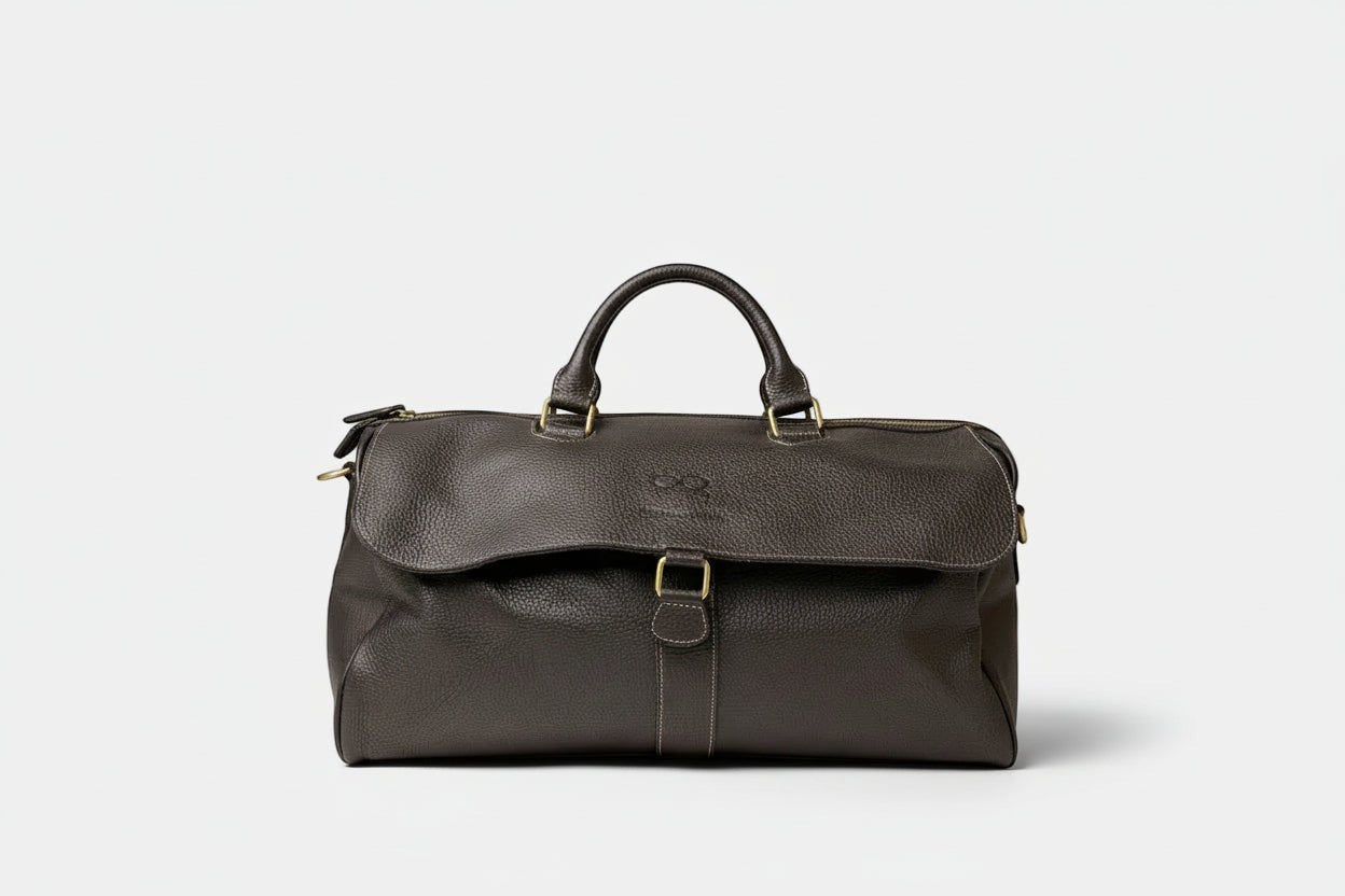 Barcon Getta Guzzo Duffel Travel Bag – Black – Front Profile Full Grain Leather with Brass Hardware - 
 on a light gray background