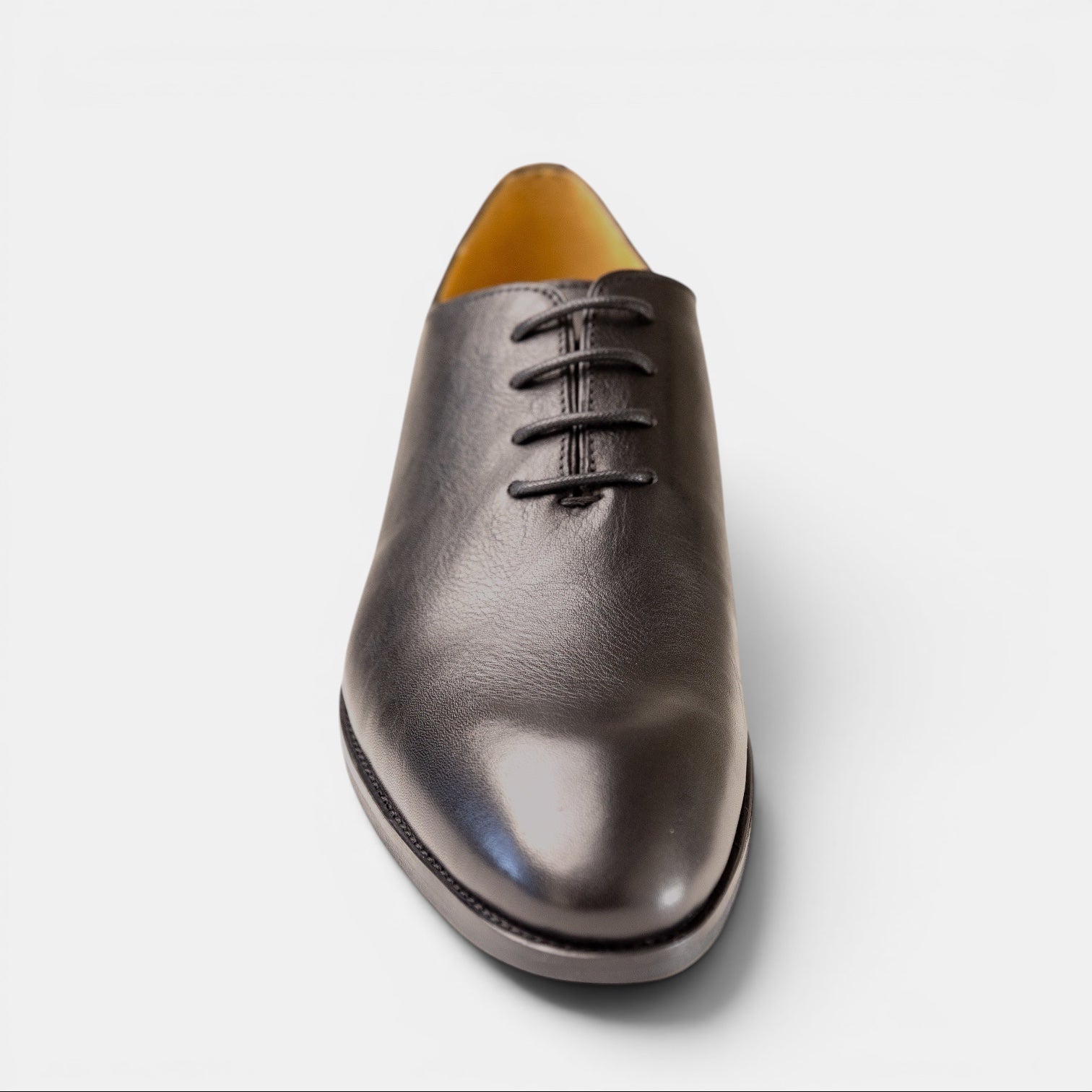 Barcon Getta Inc IFE whole-cut Oxford dress shoes in deep charcoal graphite leather with subtle blue-grey iridescence. Minimalist design with no seams.