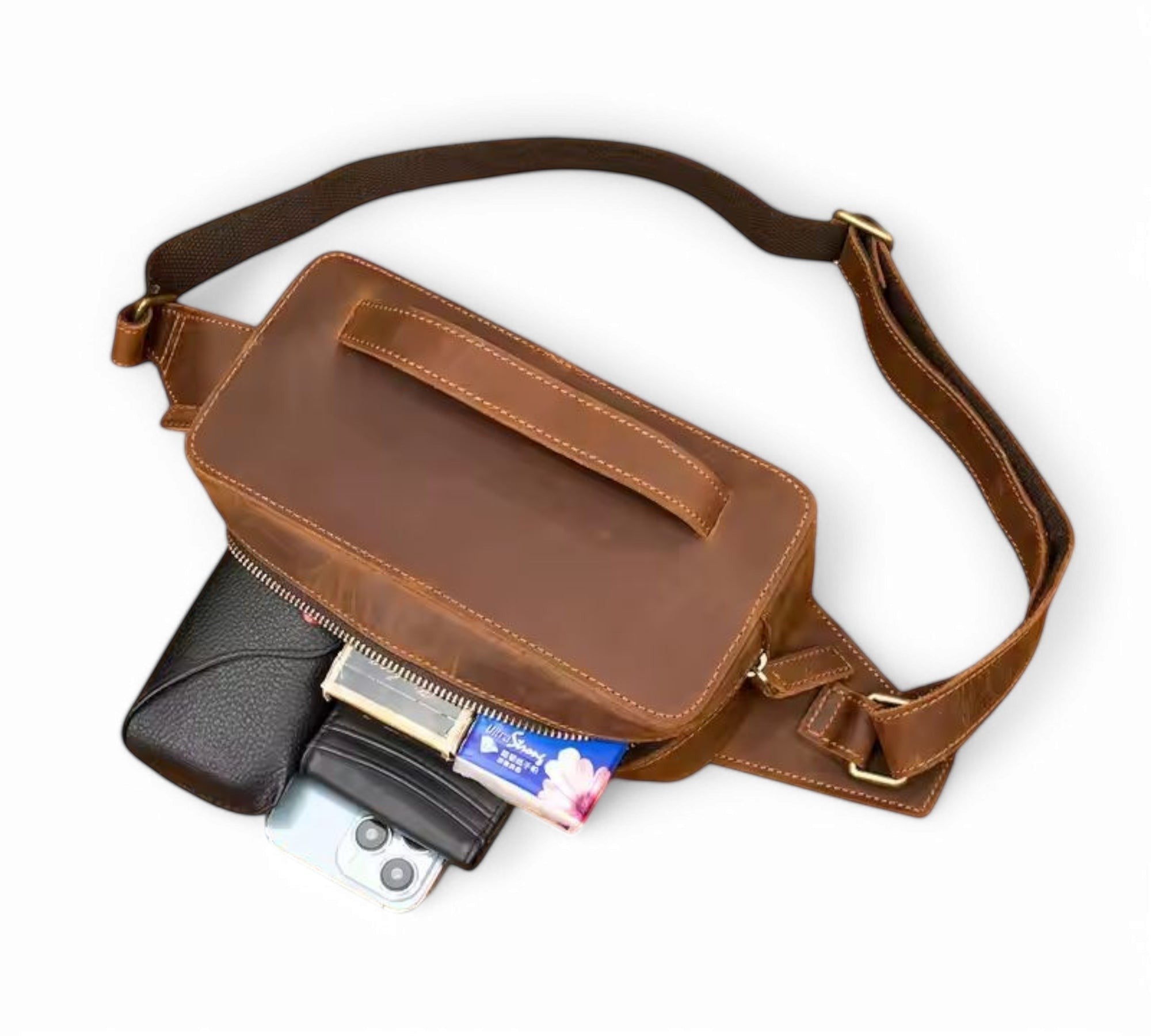 Barcon Getta Inc KANO fanny bag in brown full grain leather with multiple carrying styles. Features a main pocket and internal zipper.
