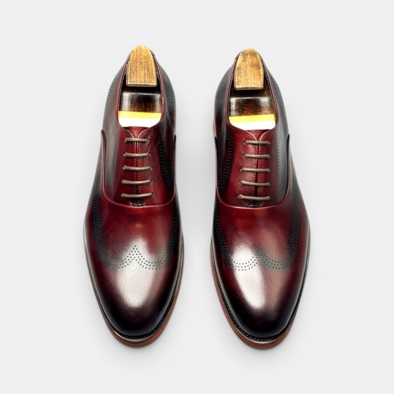 Barcon Getta Inc KIGALI oxblood burgundy full grain leather wingtip brogue Oxford dress shoes with burnt orange sole.