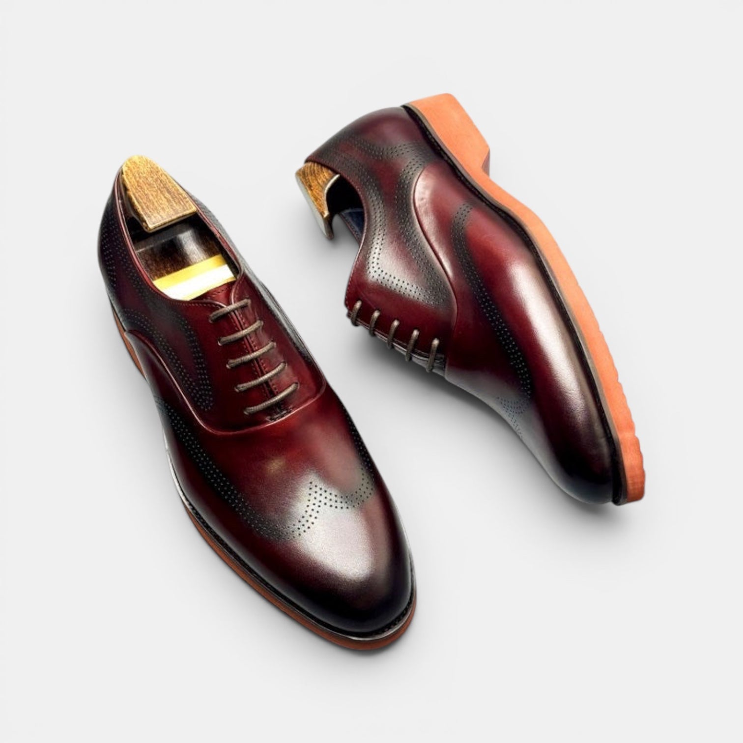 Barcon Getta Inc KIGALI oxblood burgundy full grain leather wingtip brogue Oxford dress shoes with burnt orange sole.