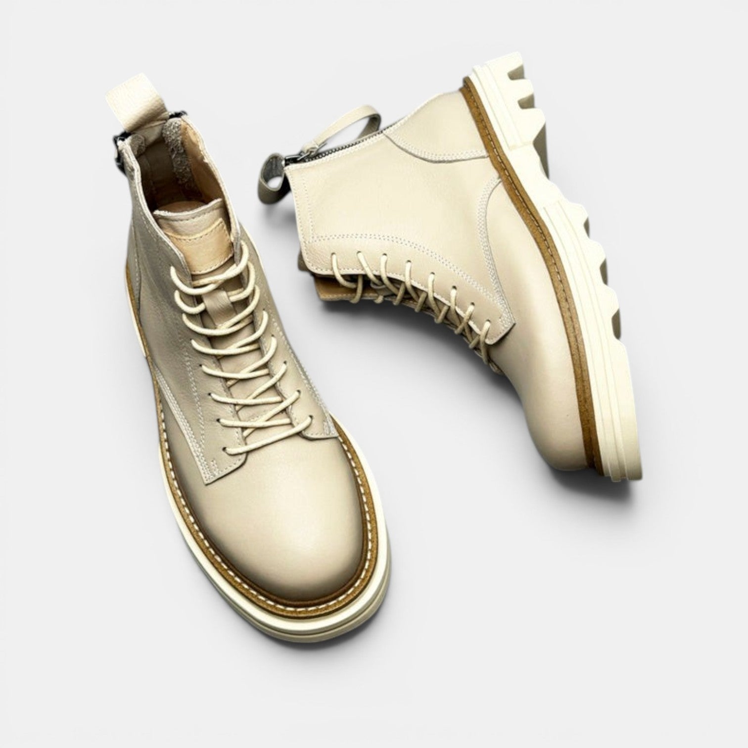 Barcon Getta Inc cream leather lace-up boots with chunky sole and side zip detail.