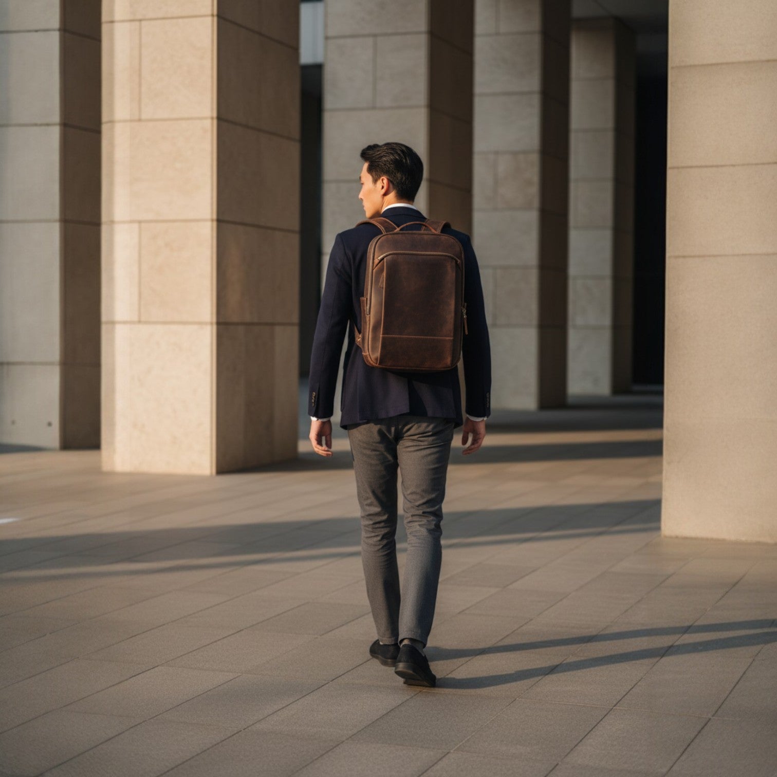 Barcon Getta Inc dark brown Ethiopian leather backpack with multiple zipper pockets and breathable straps.