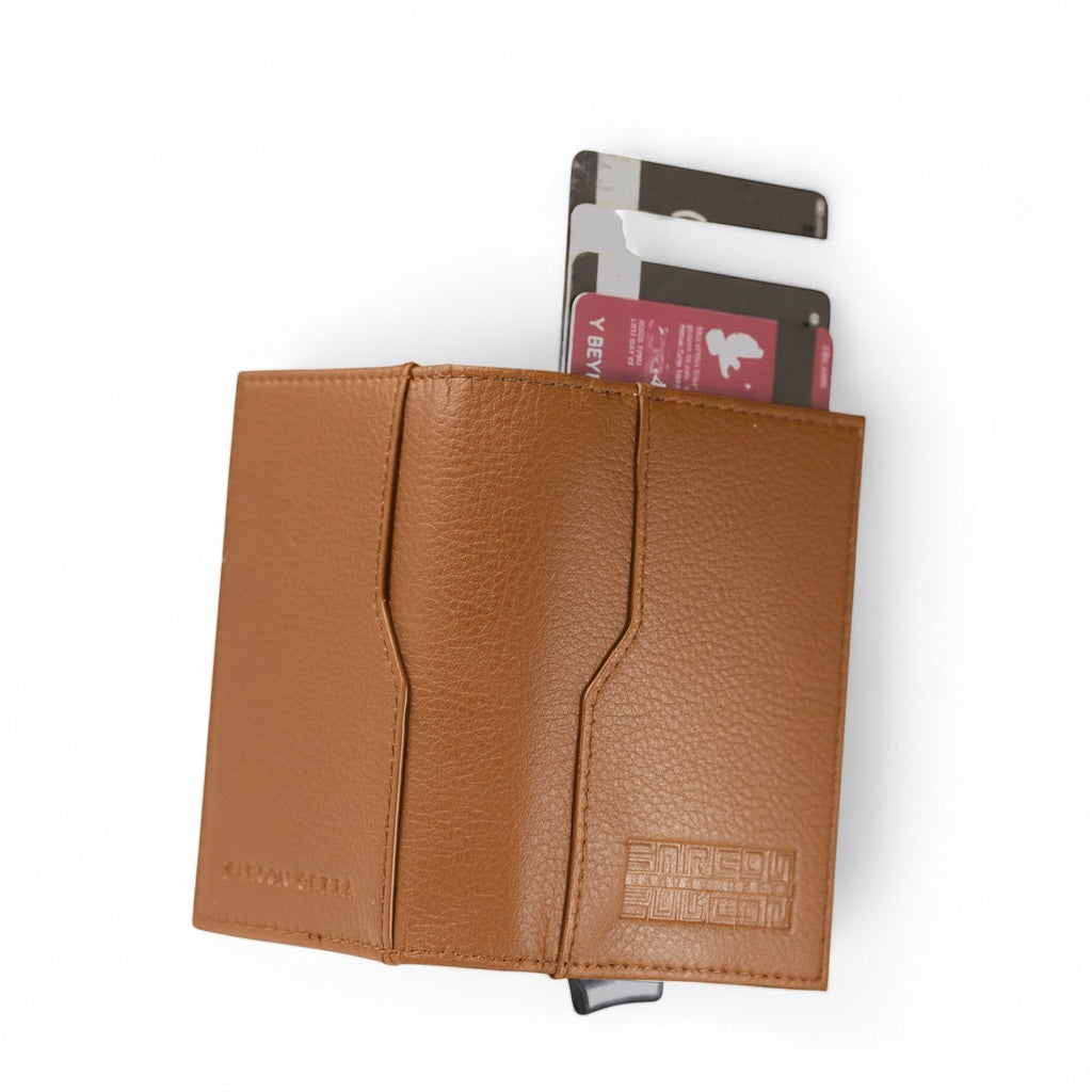 Barcon Getta Inc dark brown full grain Ethiopian calf leather card holder with embossed logo and cards inserted.