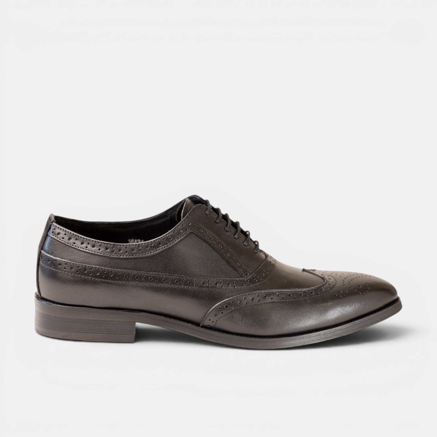 Barcon Getta Inc LOME full brogue wingtip Oxford dress shoes in charcoal graphite leather with blue iridescence. Slim pointed toe.