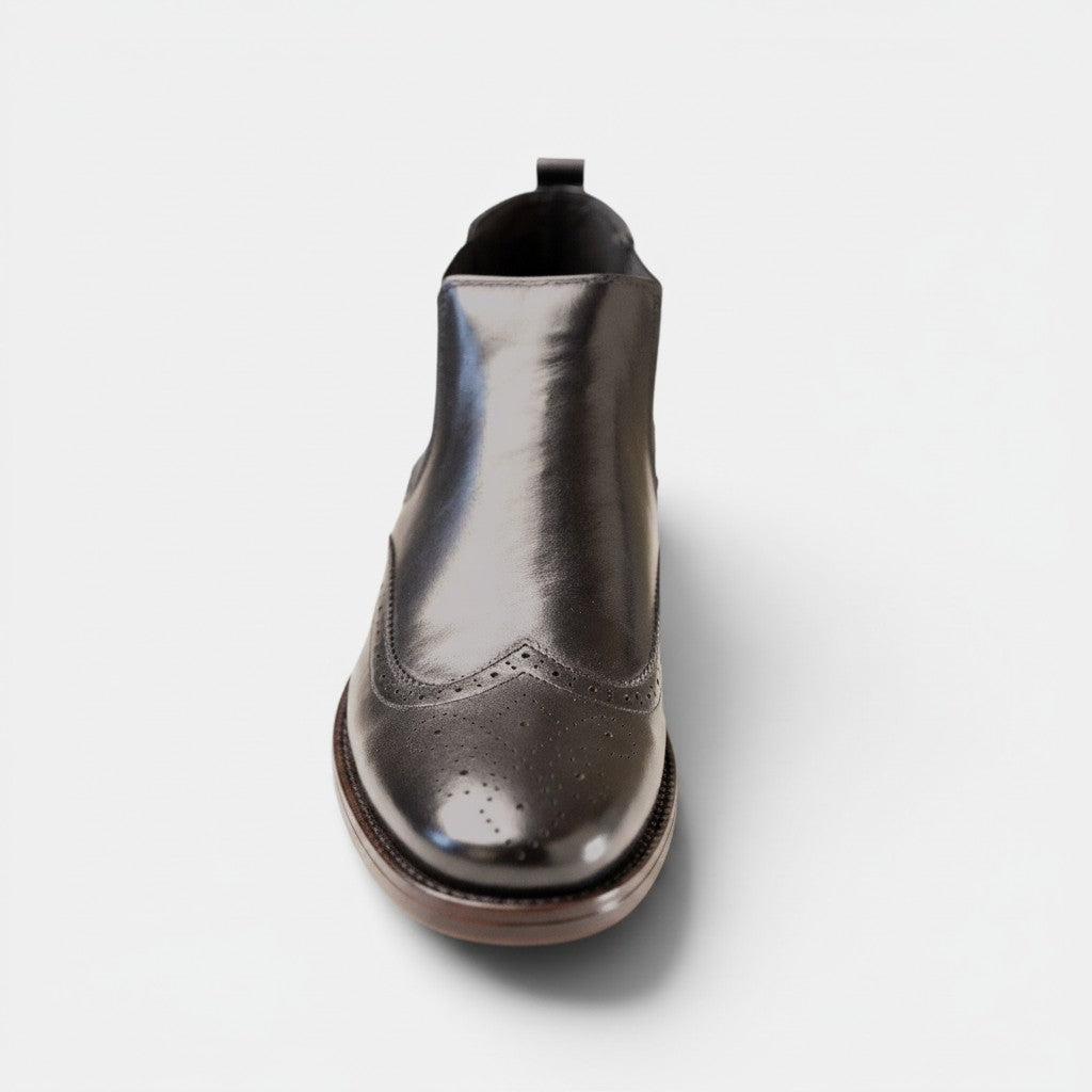 Barcon Getta Inc LUANDA black full grain leather wingtip chelsea boots with brogue detailing.