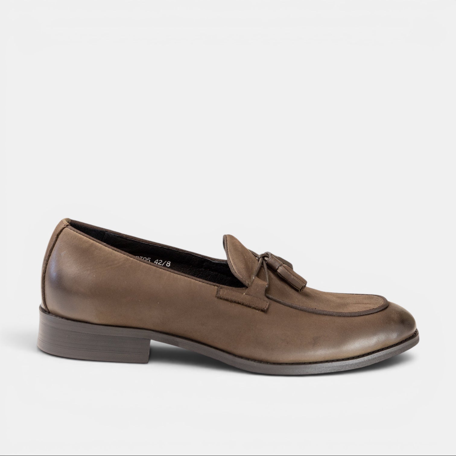 Barcon Getta Inc MANZINI taupe full-grain leather tassel loafer with apron toe and matte-burnished finish.