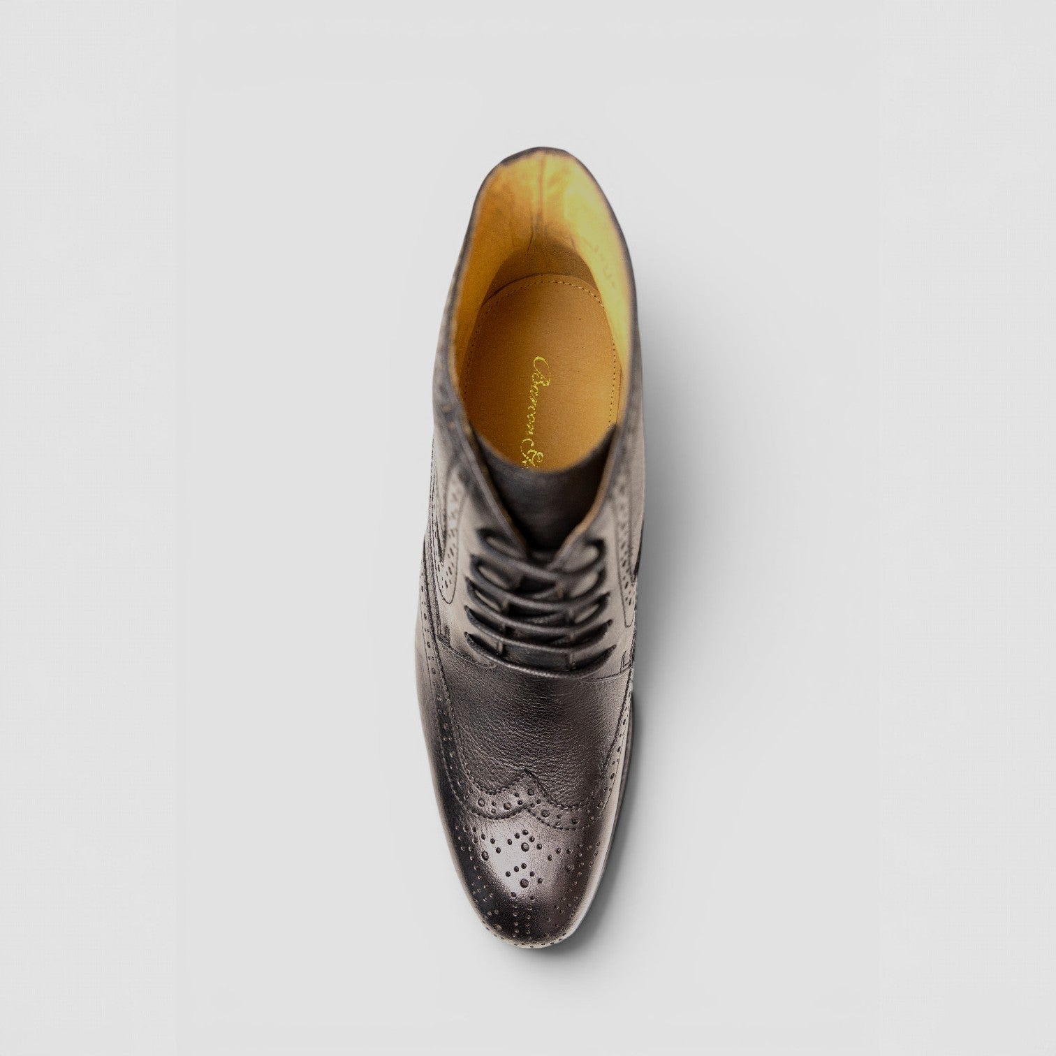 Barcon Getta Inc MAPUTO dark brown textured leather wingtip lace-up boots with brogue detailing.