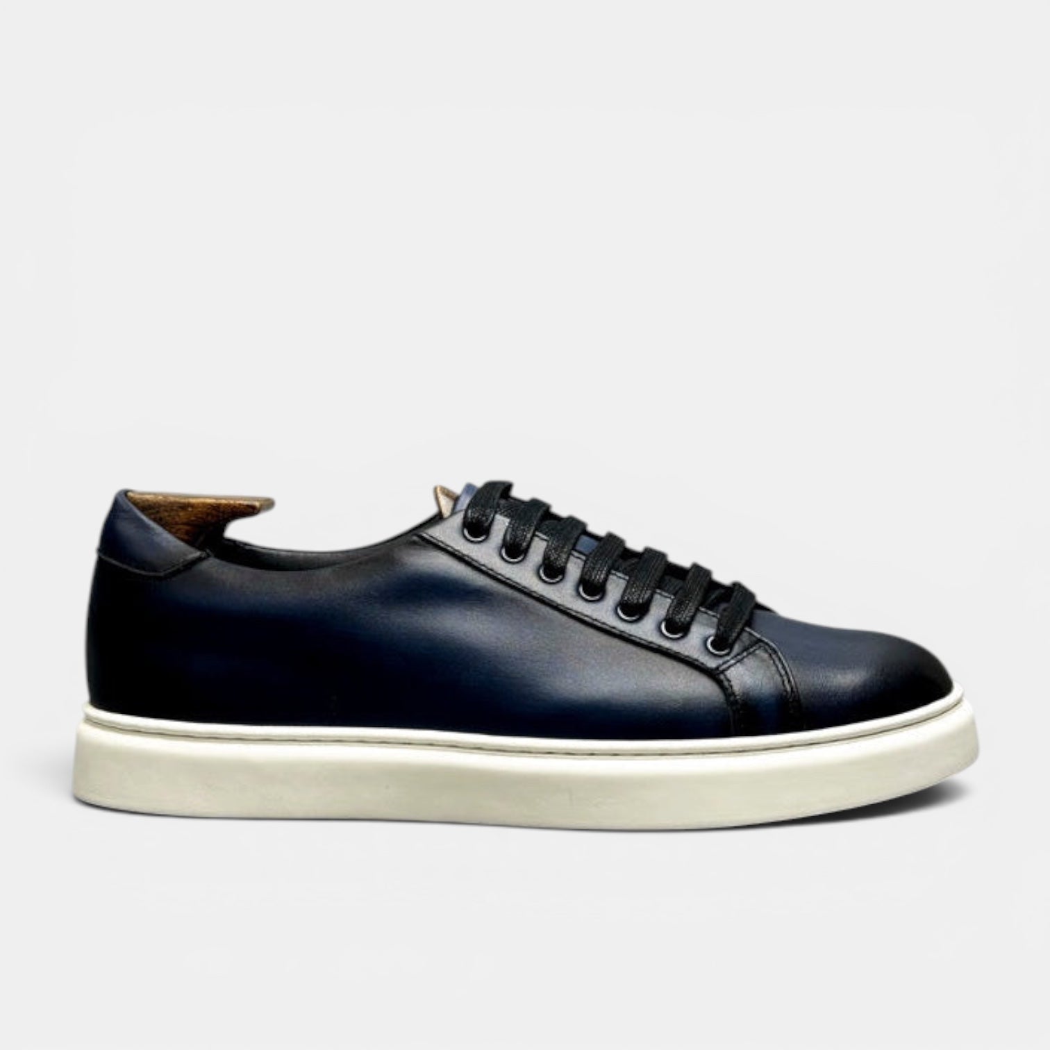 Barcon Getta Inc MEDA LOW TOP sneakers in hand-burnished deep navy full grain leather with white sole and black laces.