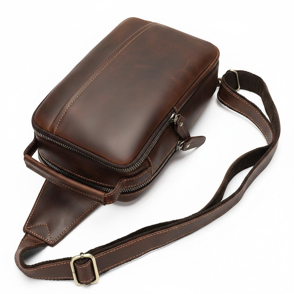 Barcon Getta Inc MERIDIAN brown genuine leather cross-body bag with adjustable strap and multiple zippered compartments.