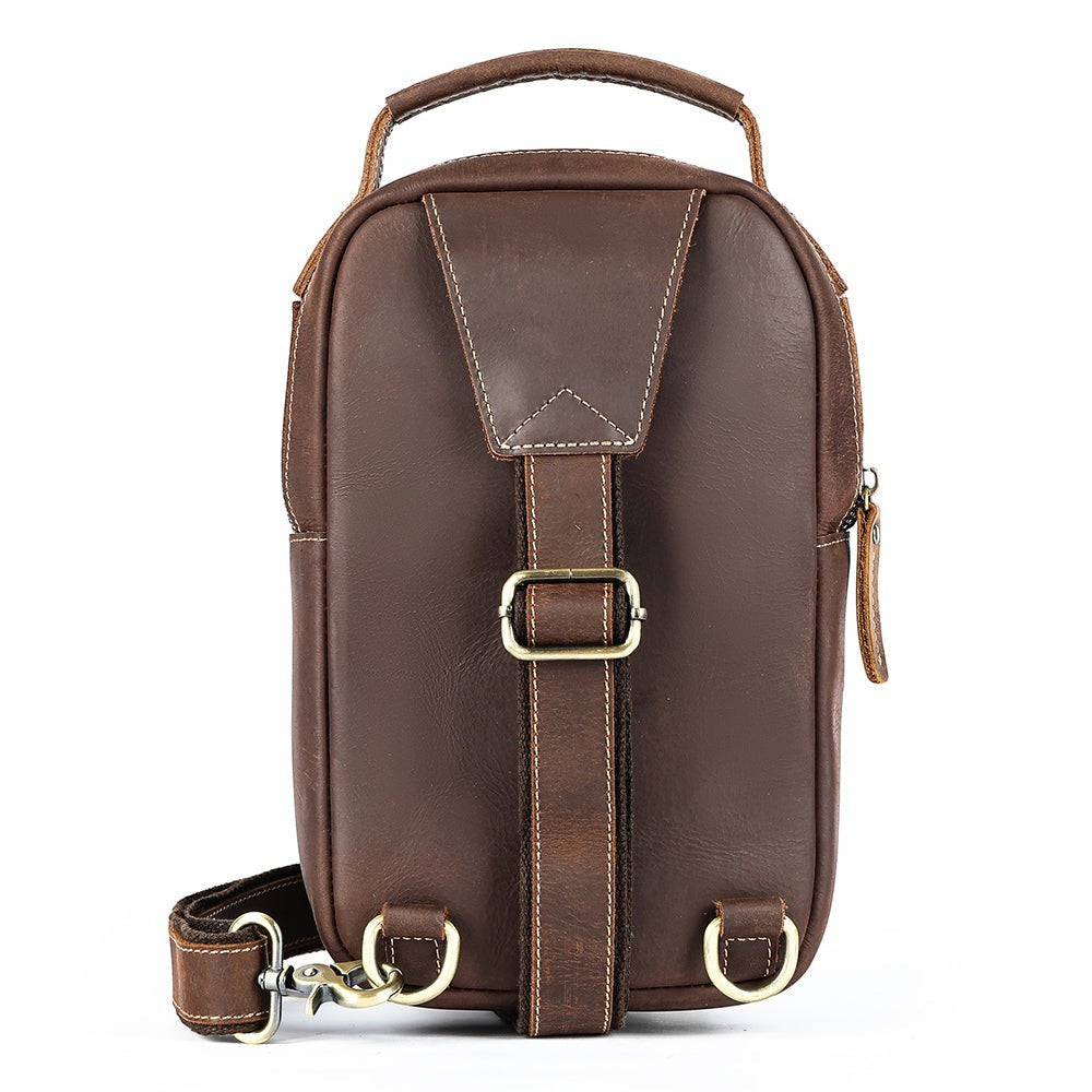 Barcon Getta Inc MERIDIAN brown leather cross-body bag with adjustable strap and zippered compartments.