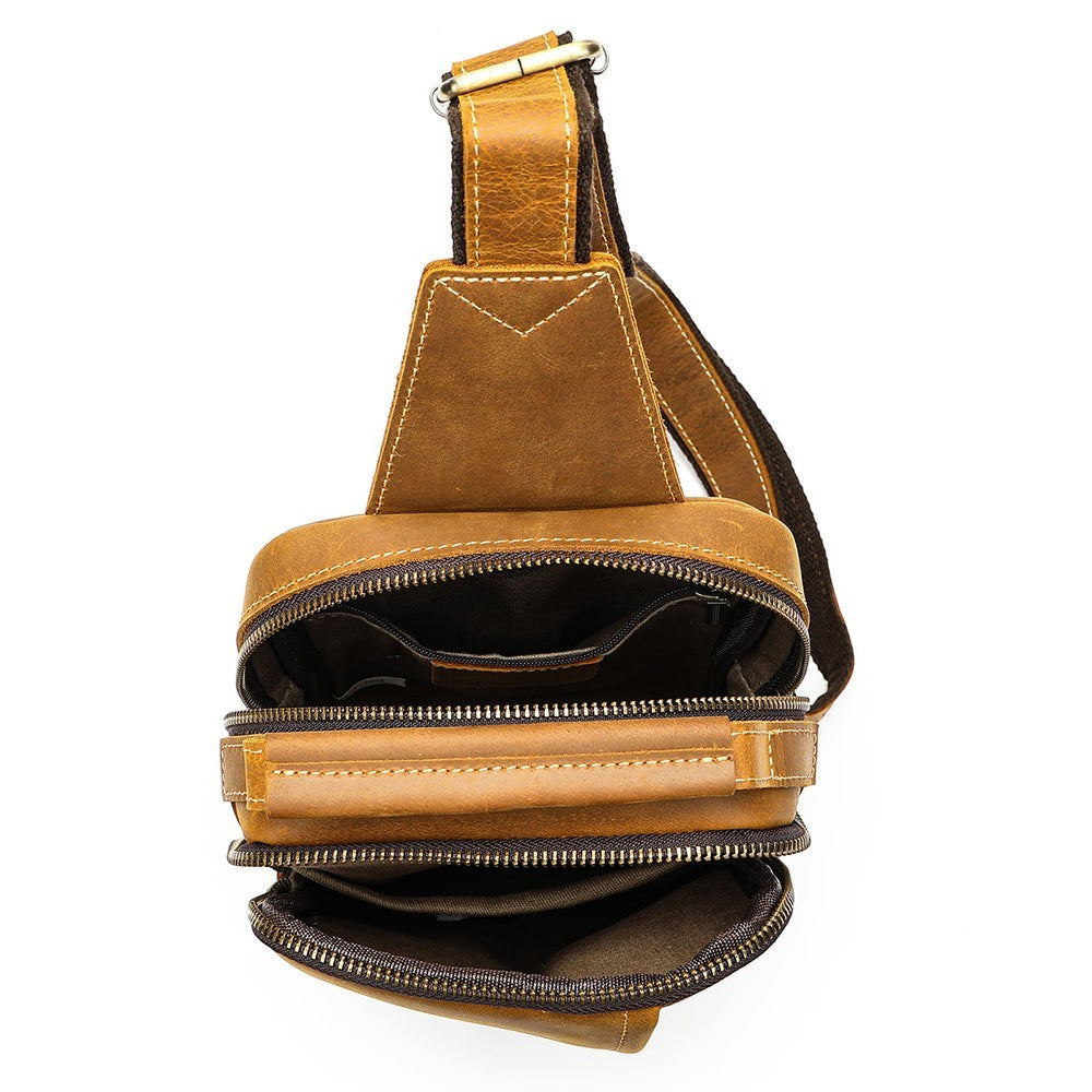 Barcon Getta Inc MERIDIAN brown leather cross-body bag with multiple zippered compartments and adjustable strap.