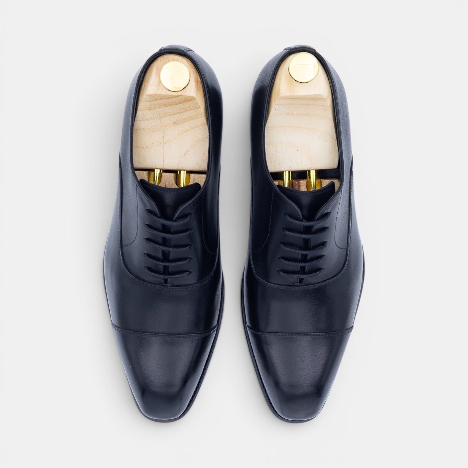 Barcon Getta Inc MOGADISHU CLASS navy full grain leather cap toe Oxford dress shoes with closed lacing.