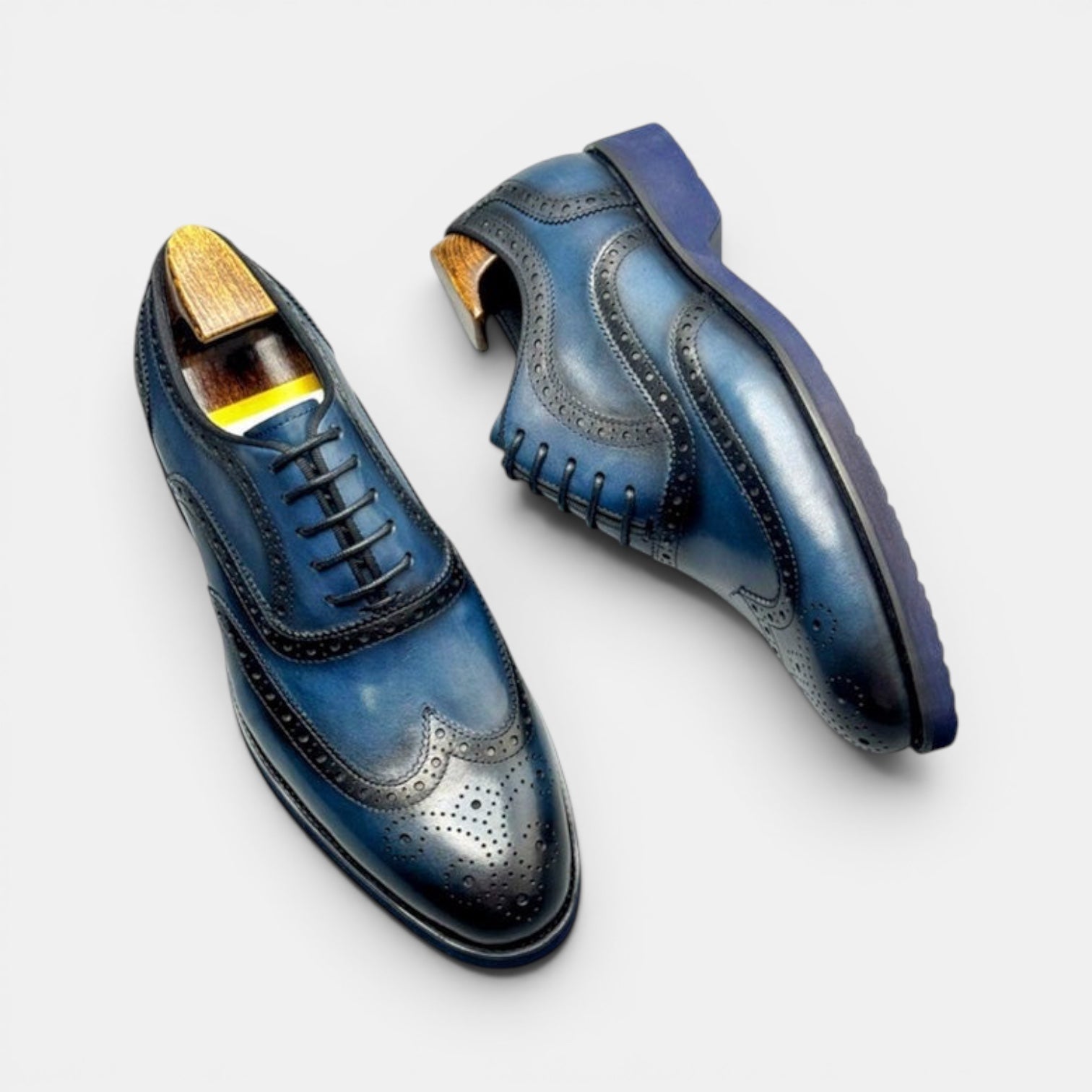 Barcon Getta Inc PORTO-NOVO deep navy blue full grain leather wingtip Oxford dress shoes with brogue detailing and rubber sole.