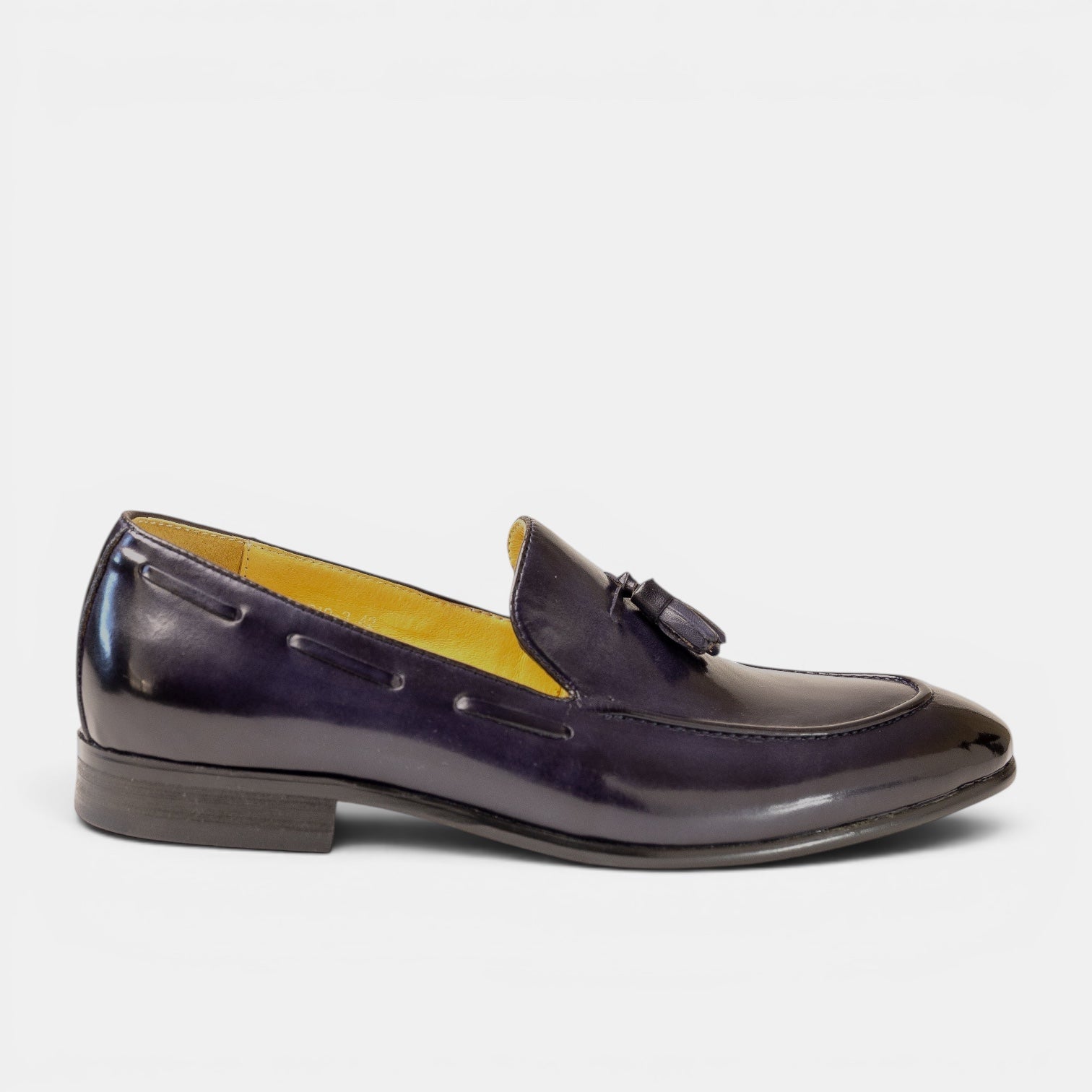 Barcon Getta Inc. deep navy full grain leather tassel loafer with a mirror-polished finish and bright amber lining.
