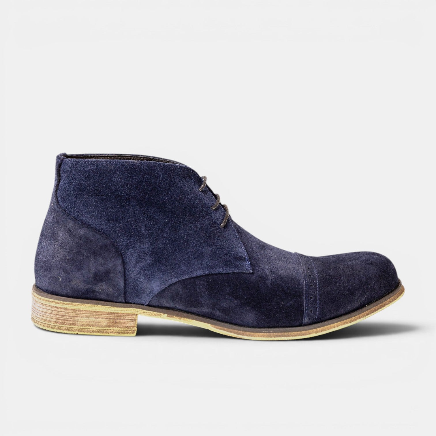 Barcon Getta Inc DJENNE navy blue suede leather chukka boots with cap toe detail and lace-up closure.