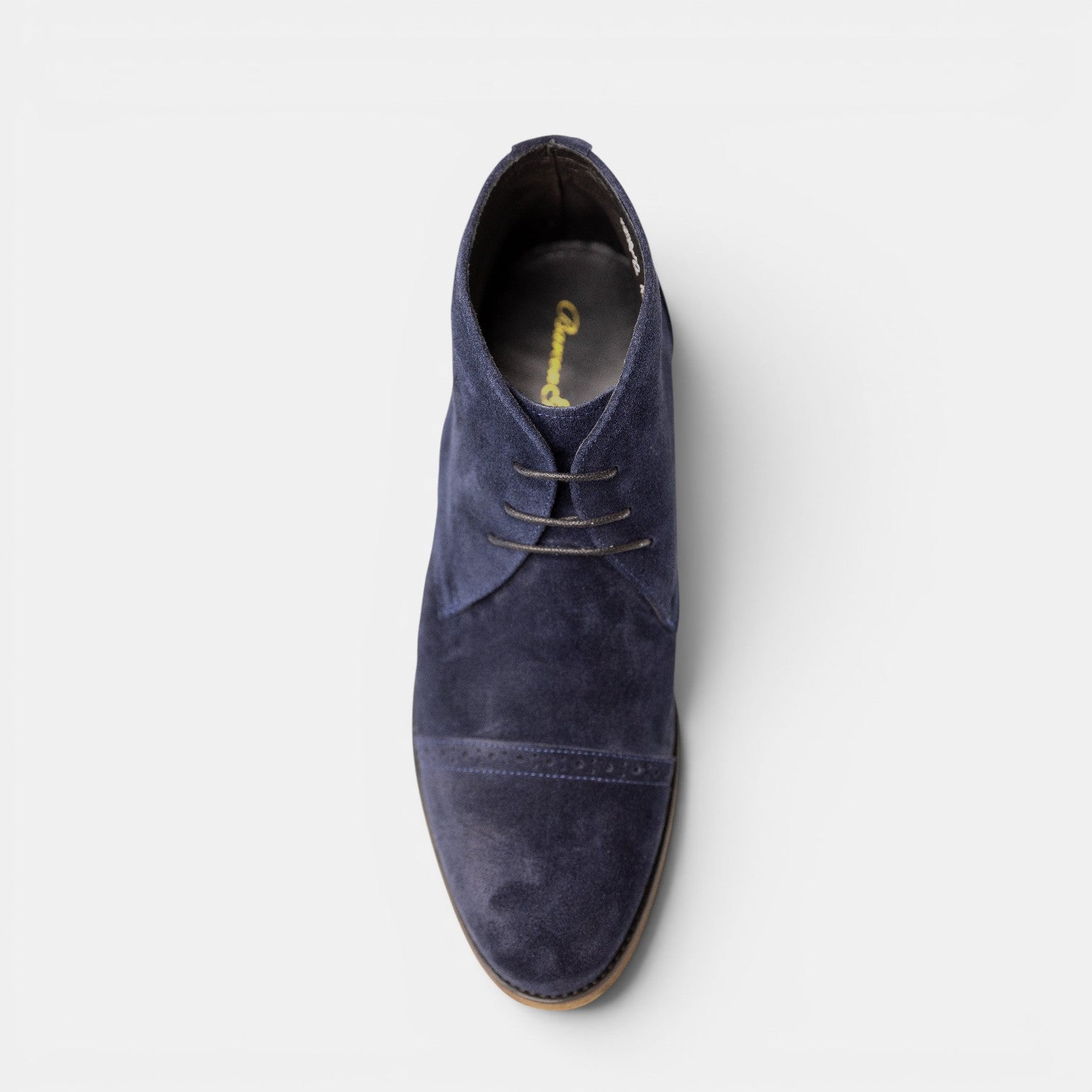 Barcon Getta Inc DJENNE navy suede chukka boots with brogue detailing and lace-up closure.