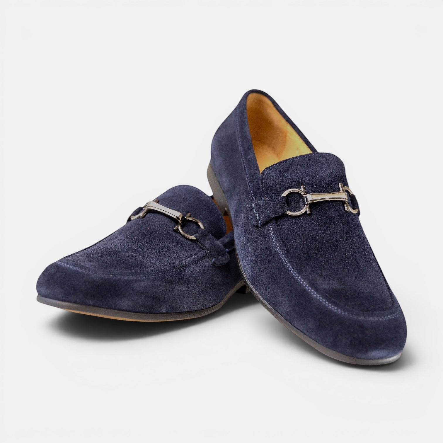 Barcon Getta Inc navy blue suede horsebit loafers with silver-tone hardware and leather sole.