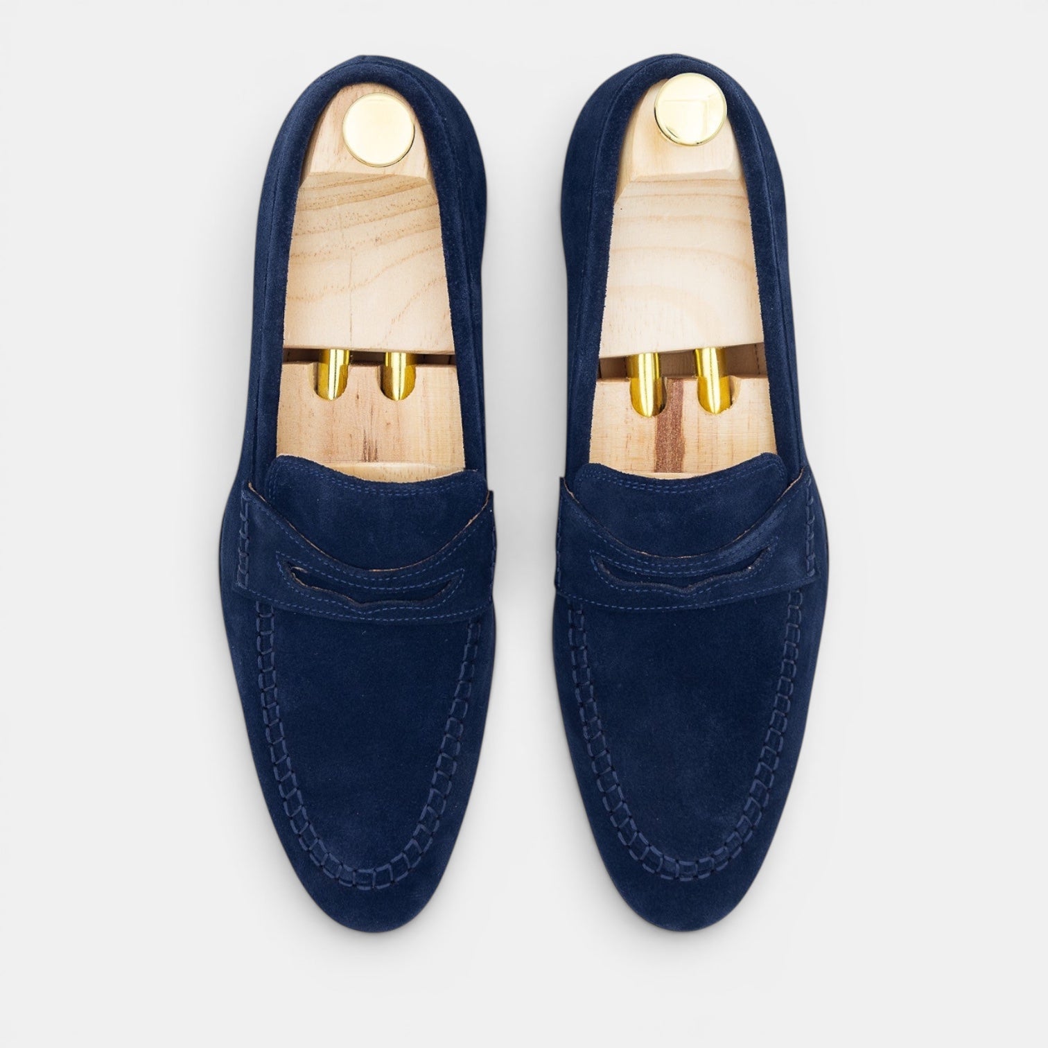 Barcon Getta Inc navy suede PHAROAH penny loafers with hand-stitched moccasin toe and tan leather insole.