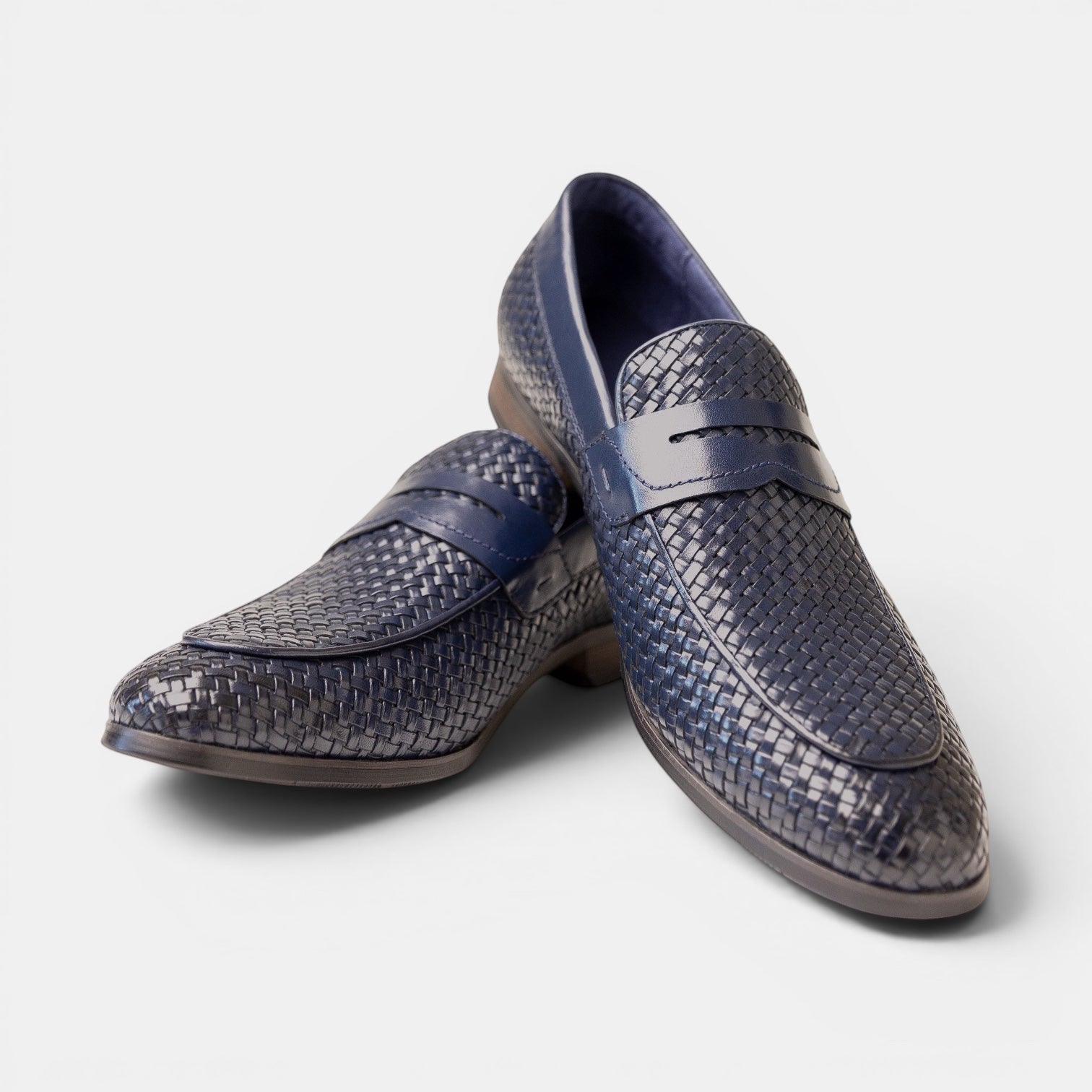 Barcon Getta Inc navy blue woven full-grain leather penny loafers with smooth leather strap and hybrid sole.