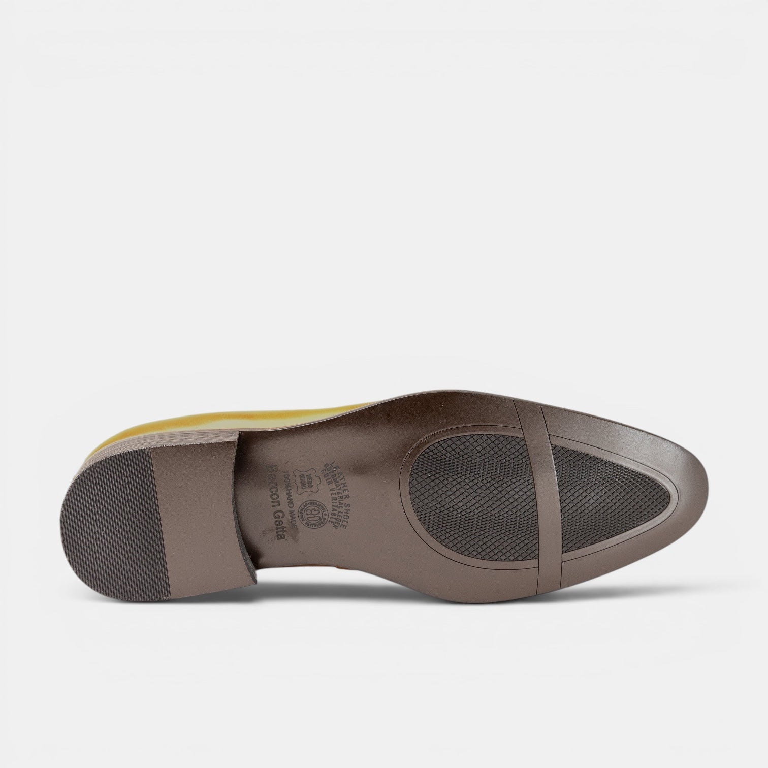 Barcon Getta Inc NEGA tassel loafer in warm tan full grain leather. Full brogue detailing and rubber sole.