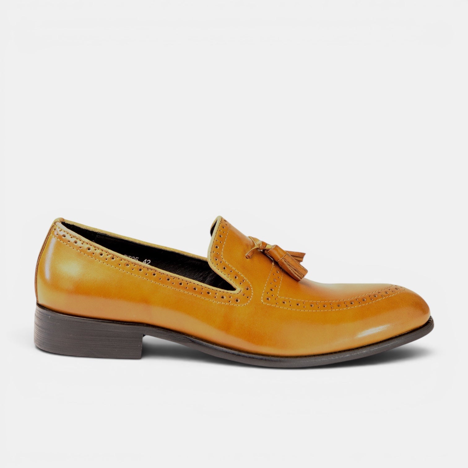 Barcon Getta Inc NEGA tassel loafer in warm tan full-grain leather with full brogue detailing and a slightly pointed toe.