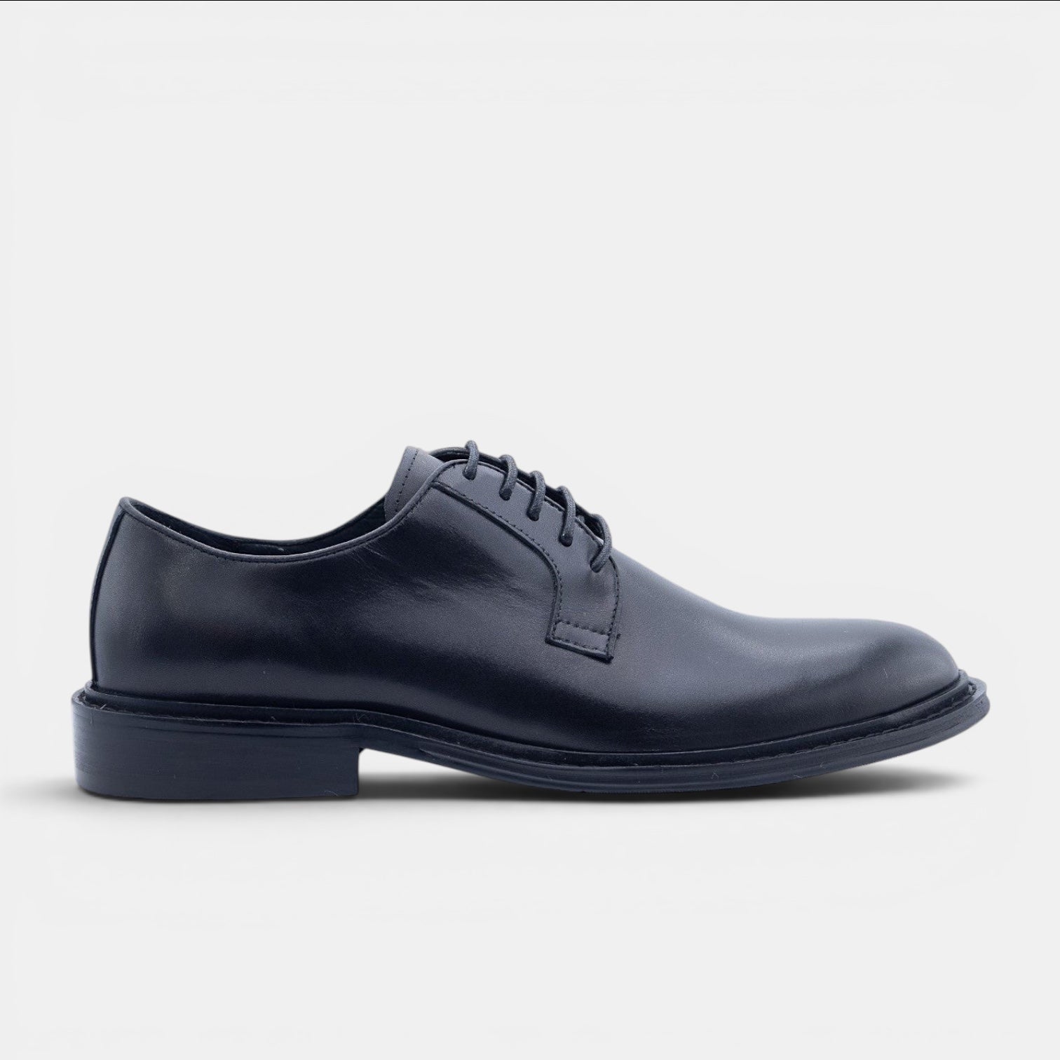 Barcon Getta Inc NYOTA black full grain leather plain toe Derby shoes with navy rubber sole.