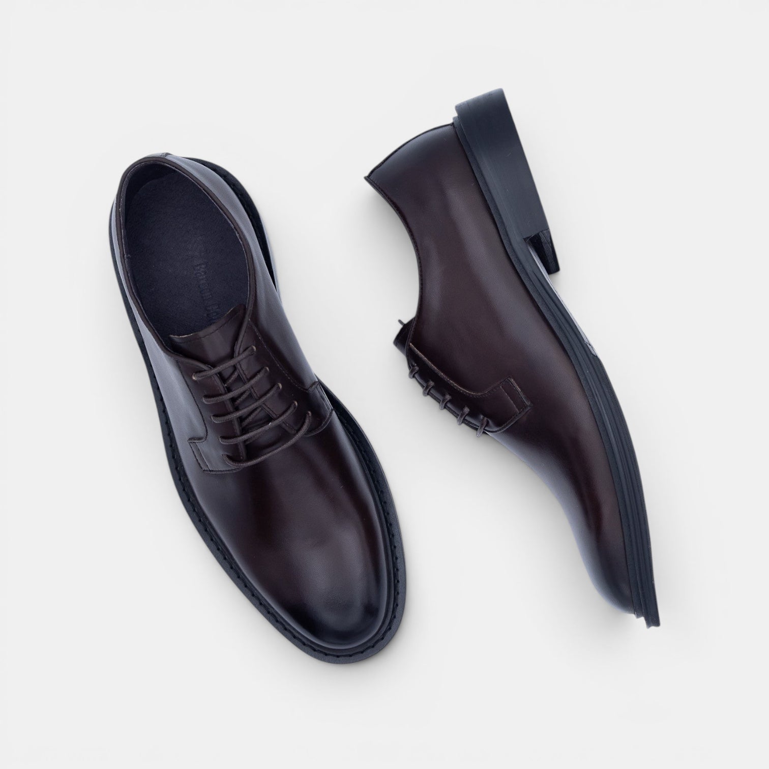 Barcon Getta Inc NYOTA plain toe Derby shoes in dark espresso brown full grain leather with navy rubber sole.