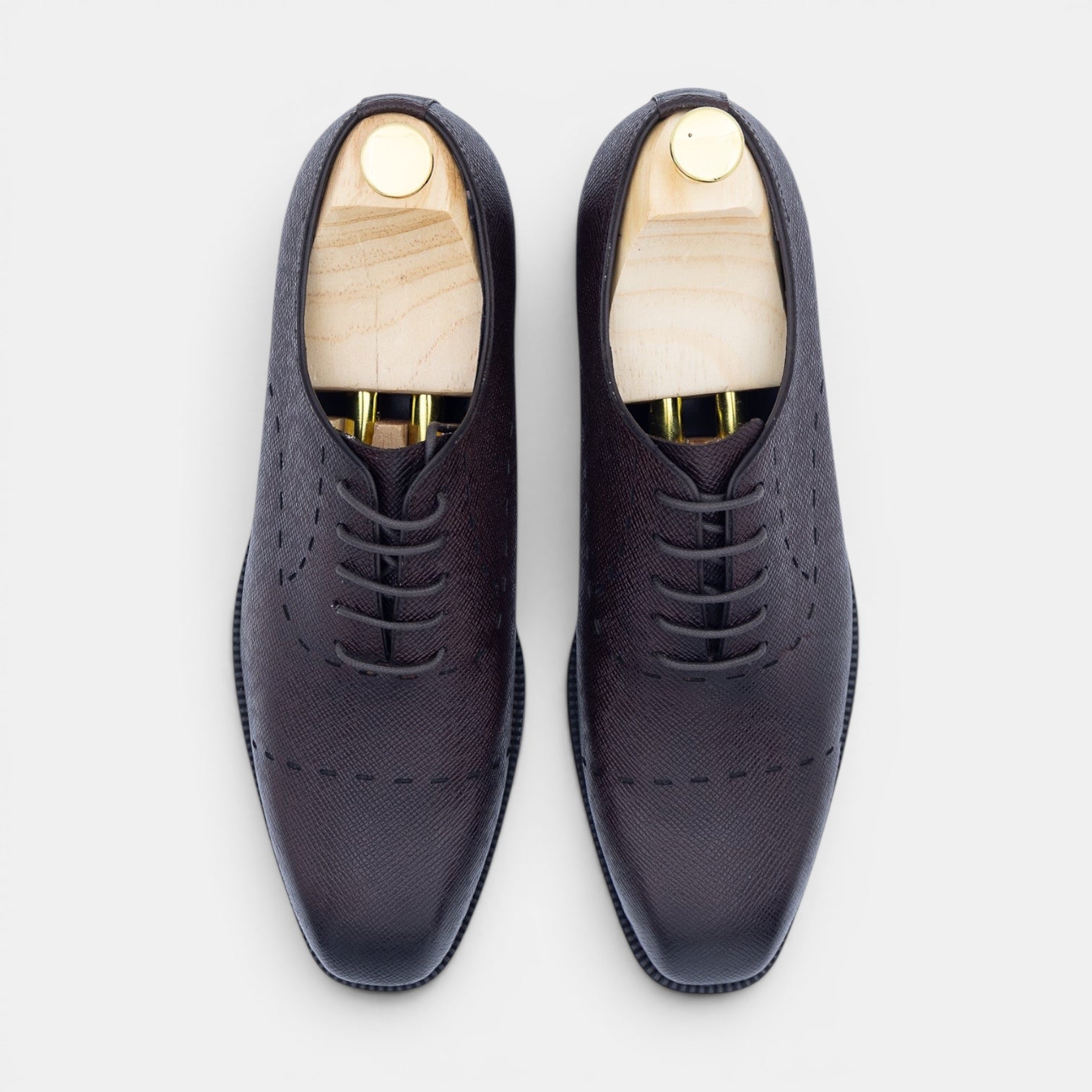 Barcon Getta Inc. oxblood brown Saffiano leather plain toe Oxford dress shoes with decorative stitching and wooden shoe trees.