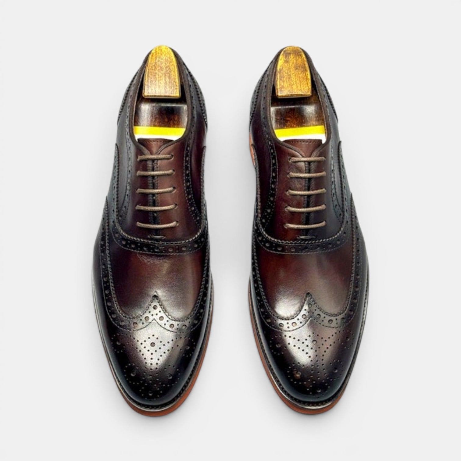Barcon Getta Inc PORTO-NOVO oxblood dark brown full grain leather wingtip Oxford dress shoes with brogue perforations and rubber sole.