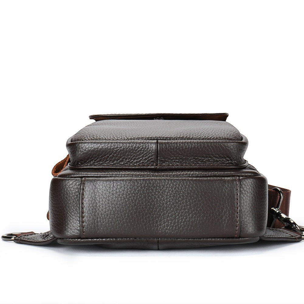 Barcon Getta Inc RIDGELINE brown textured leather cross-body bag with adjustable strap and front pocket.