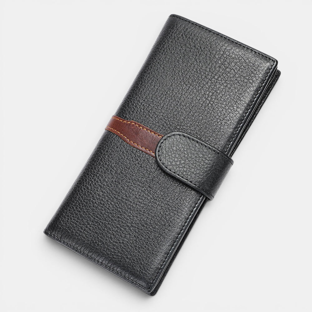 Barcon Getta Inc The Slate Long bifold wallet in black full grain leather with brown accent strap and snap closure. Features 8 card slots, bill compartments, and ID window.