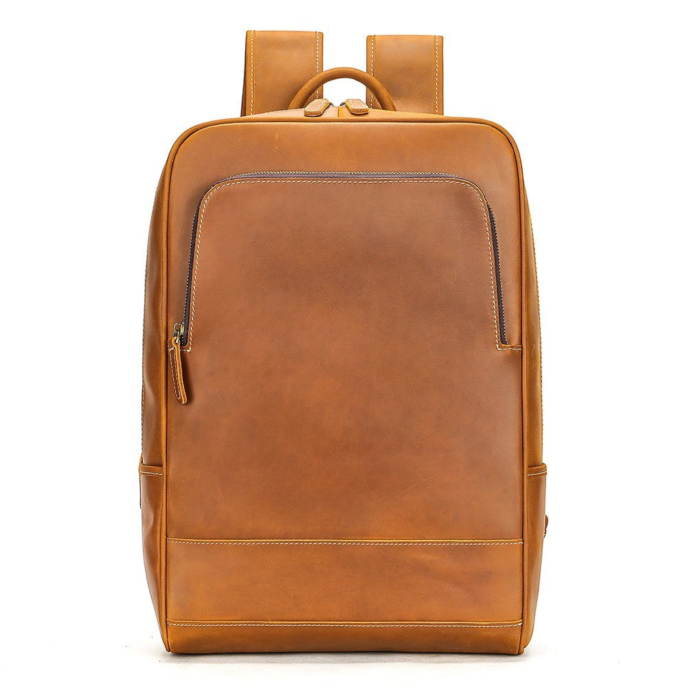Barcon Getta Inc tan genuine leather minimalist backpack with front zip pocket and adjustable straps.
