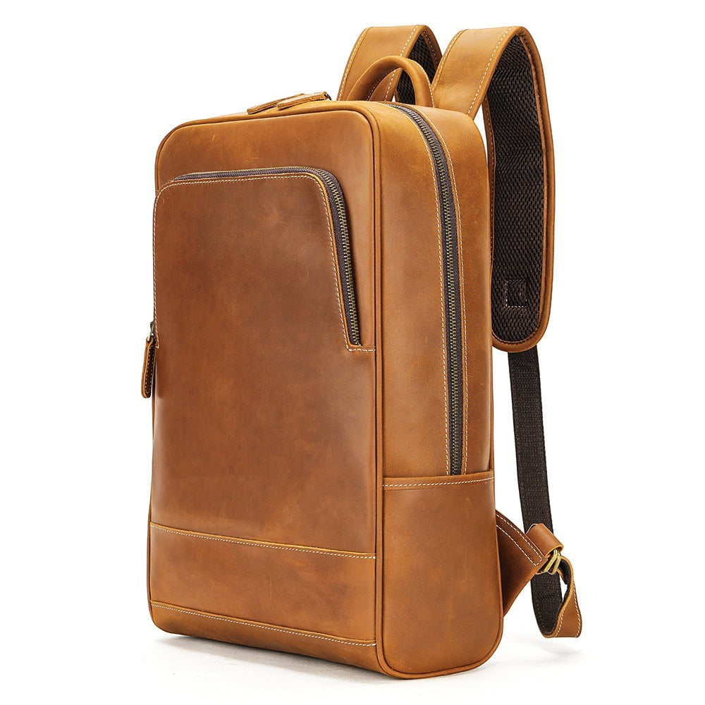 Barcon Getta Inc tan genuine leather minimalist backpack with front zip pocket and adjustable straps.