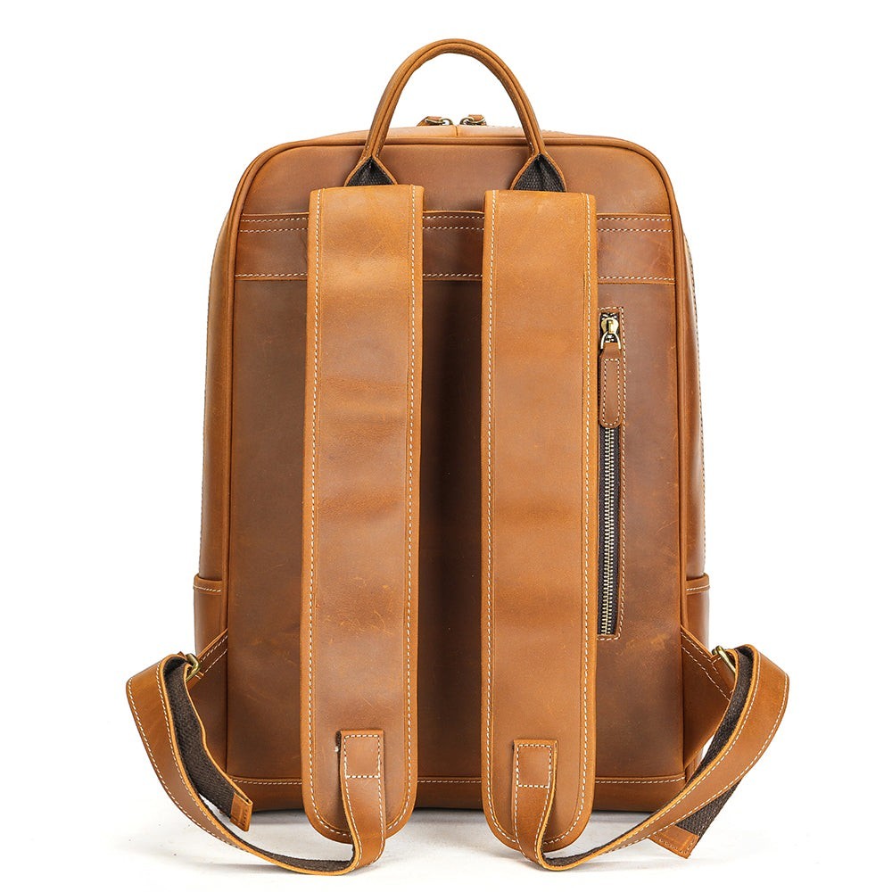 Barcon Getta Inc tan genuine leather backpack with adjustable straps and front zip pocket.