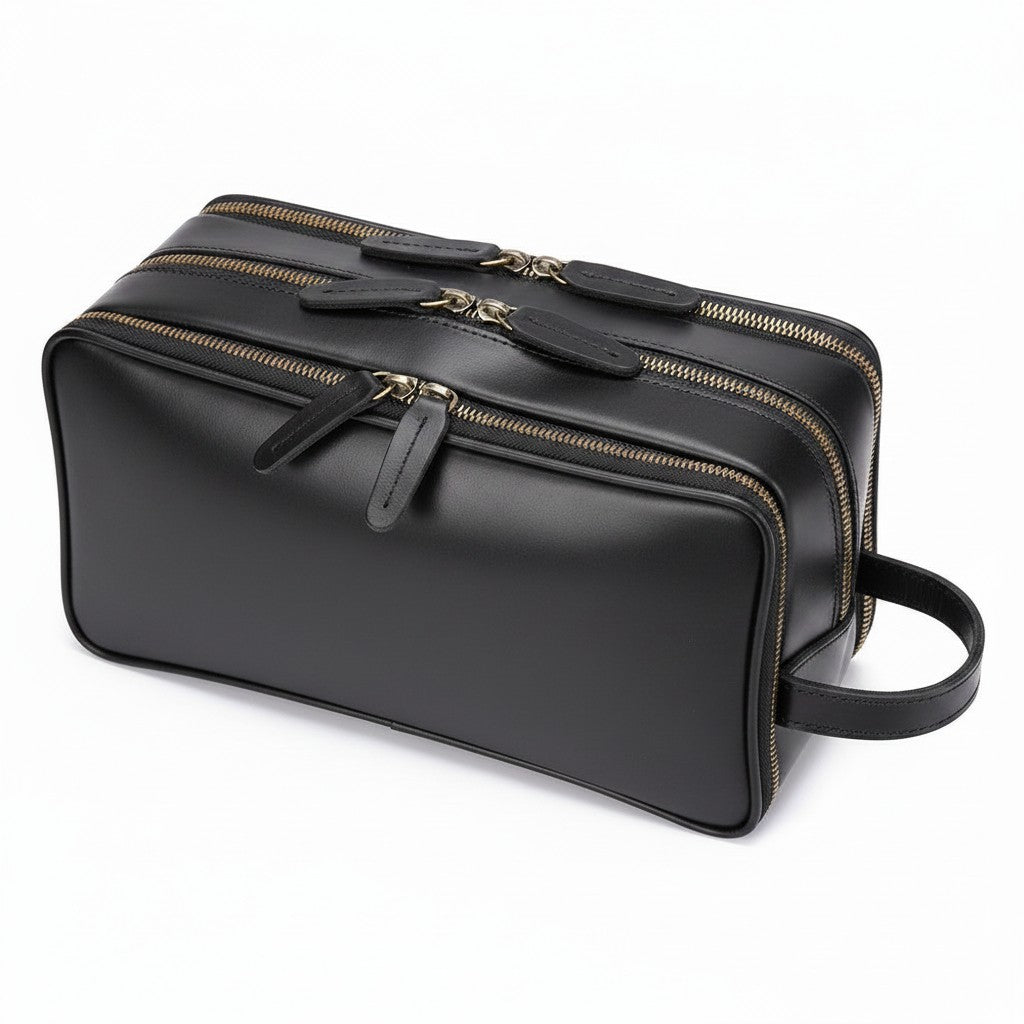 Barcon Getta Inc dark brown leather travel kit with multiple zippered compartments and a side handle.