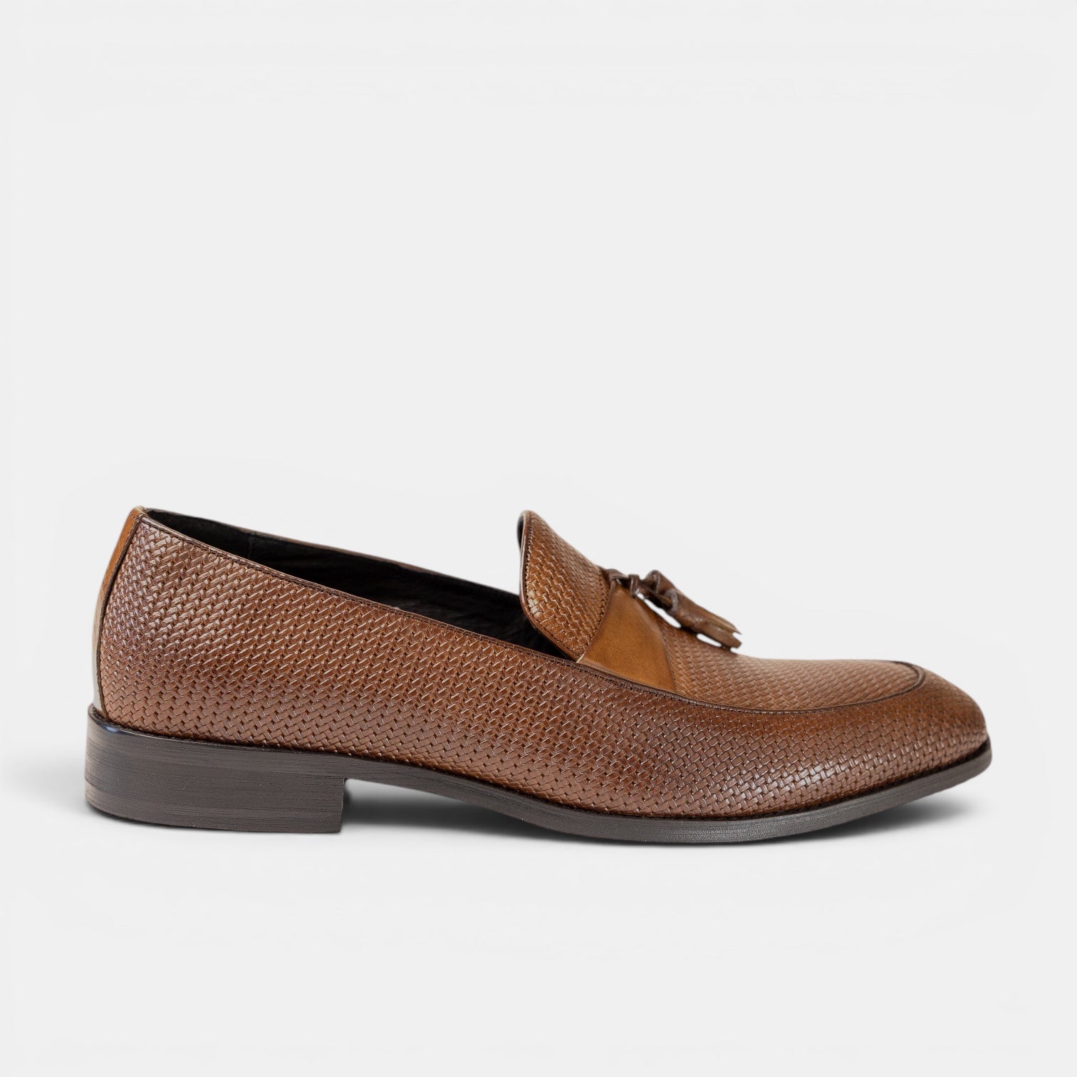 Barcon Getta Inc. men's burnished tan full-grain leather hand-woven tassel loafer with smooth leather saddle strap.