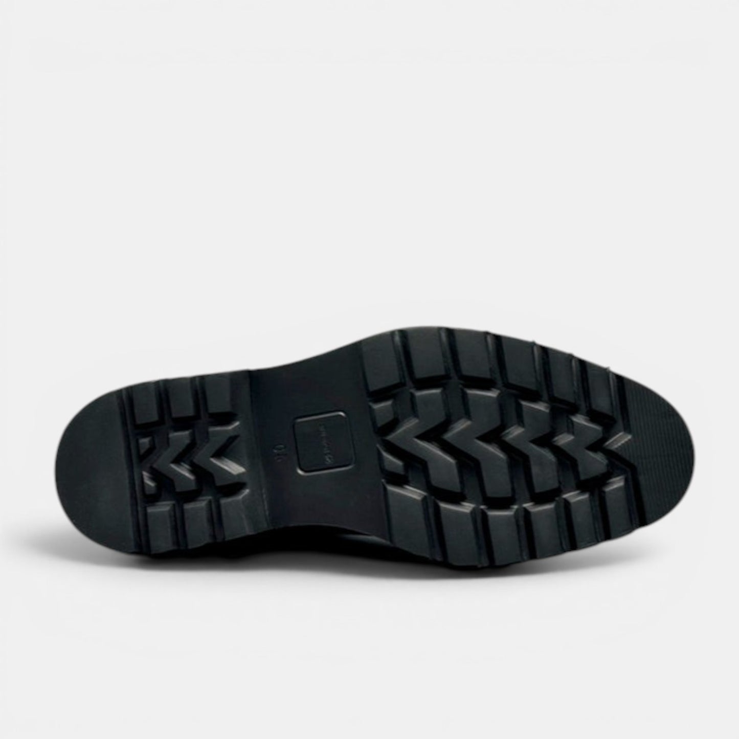 Barcon Getta Inc black leather Chelsea boot with lug sole and cap toe detail