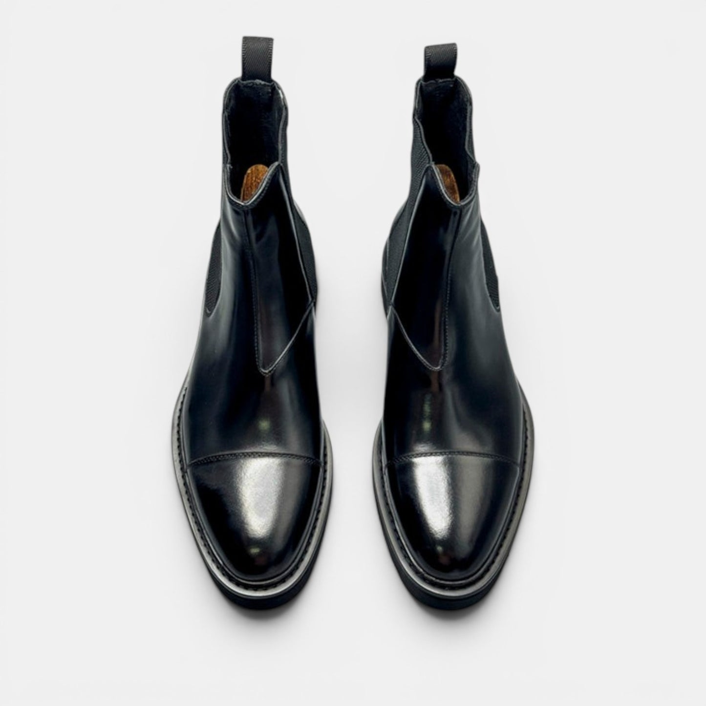 Barcon Getta Inc black leather Chelsea boots with elastic side panels and lug sole.