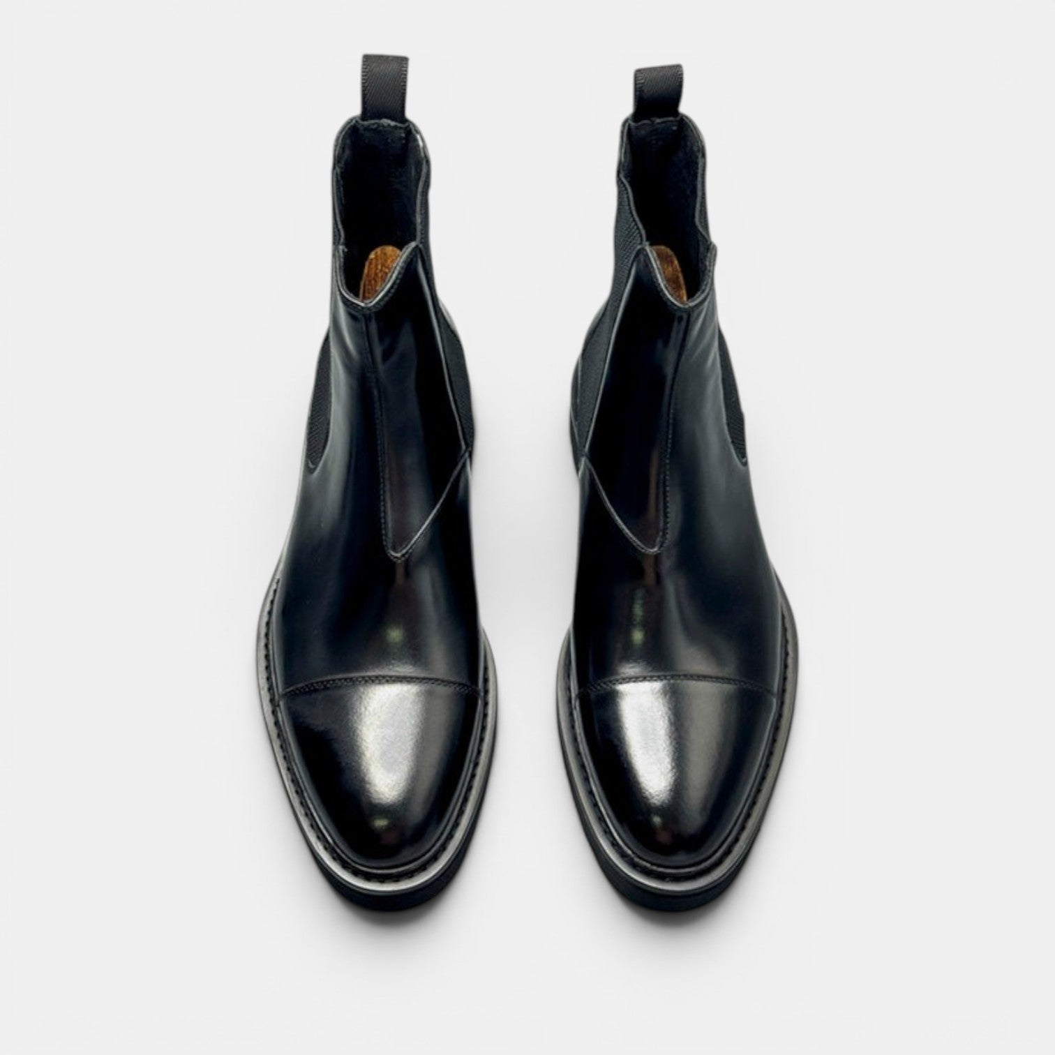 Barcon Getta Inc black leather Chelsea boots with elastic side panels and lug sole.
